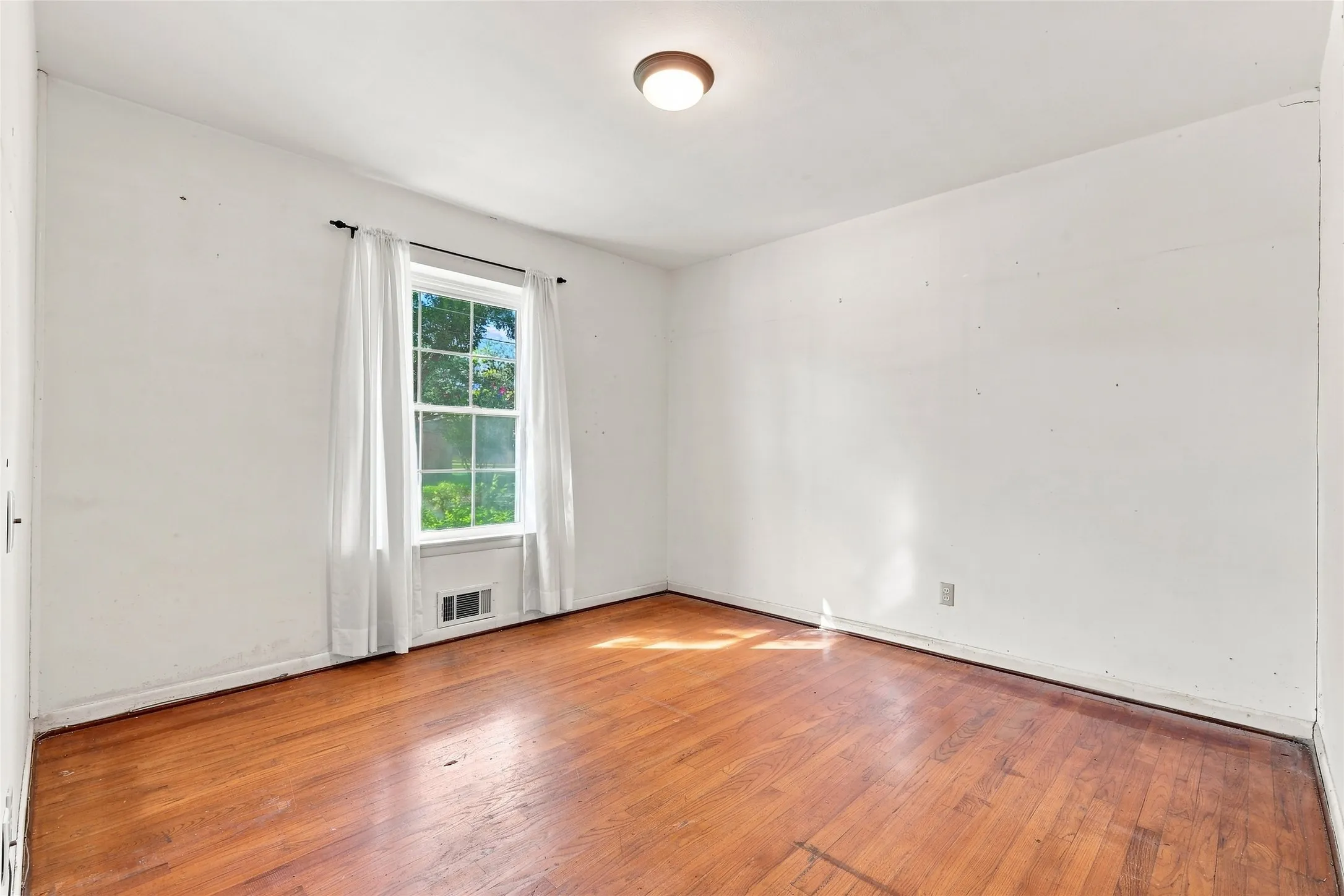 Bedroom 3  with Hardwood Flooring