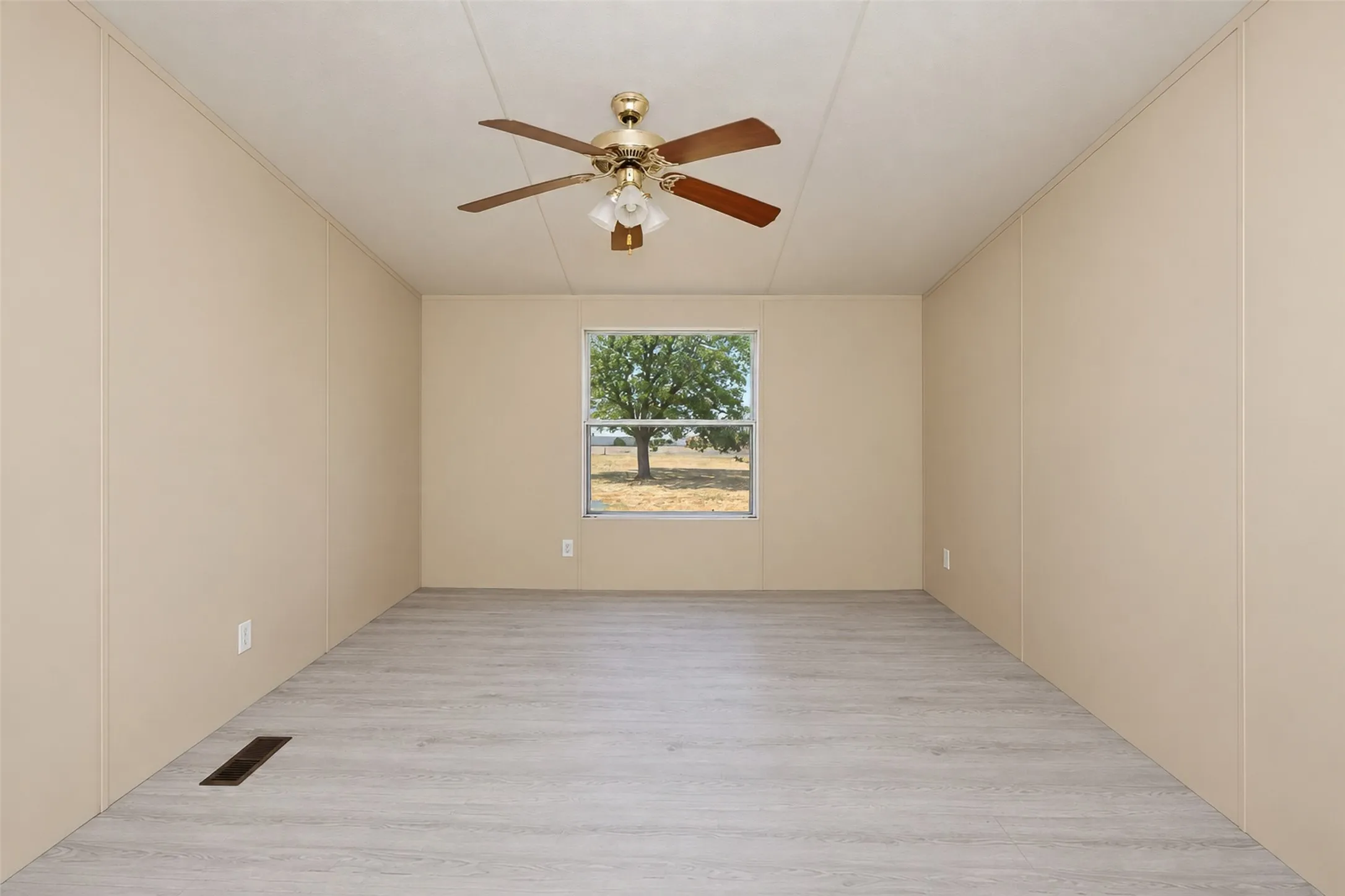 Neutral tone walls and light wood-finish flooring
