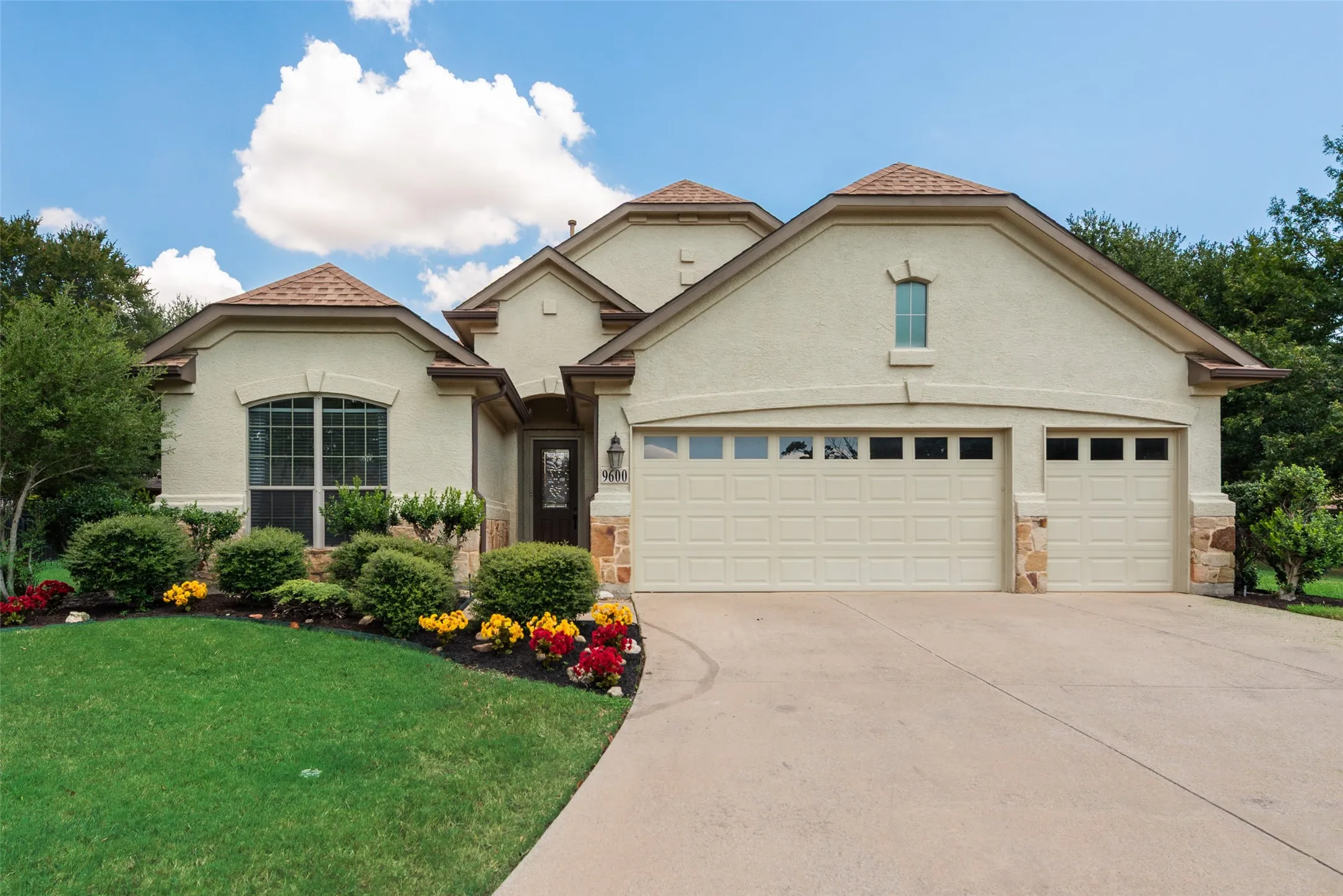 Beautiful well manicure exterior 3 car garage home