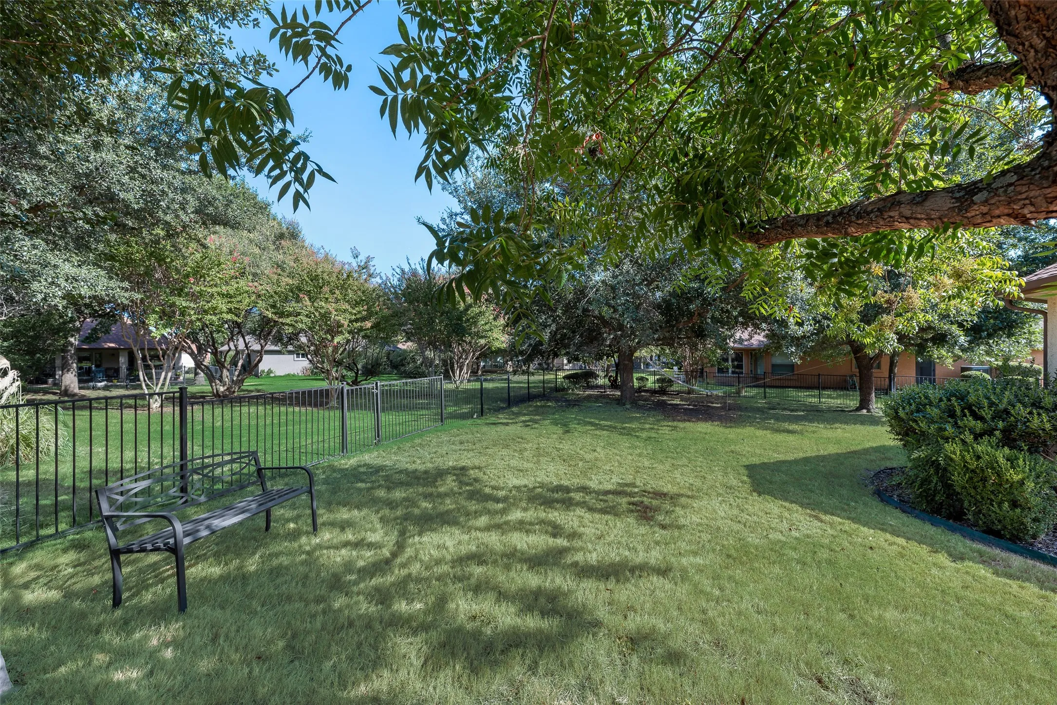 view from primary ste, oversized green belt, metal fencing,