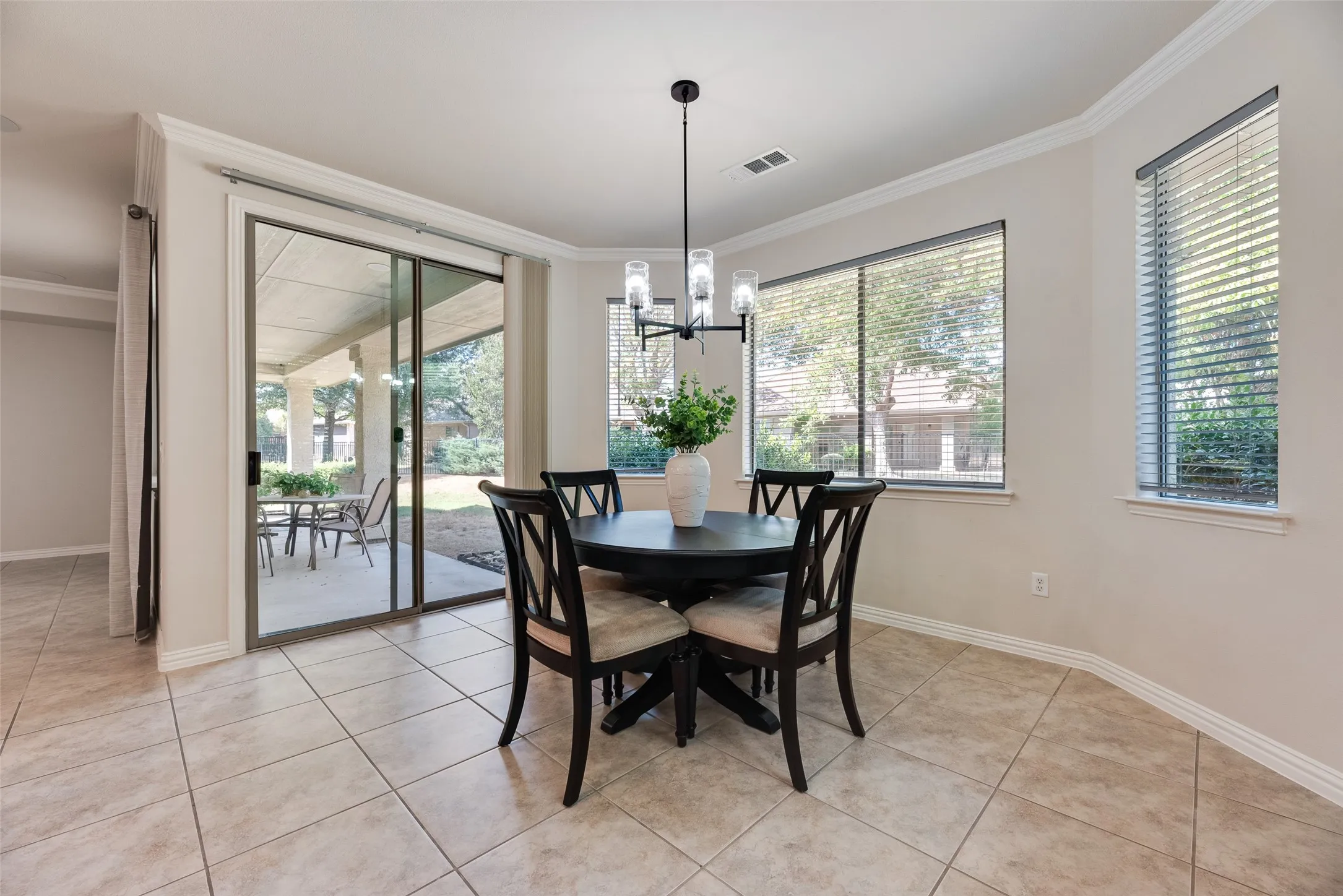 spacious dining overlook the back yard and patio