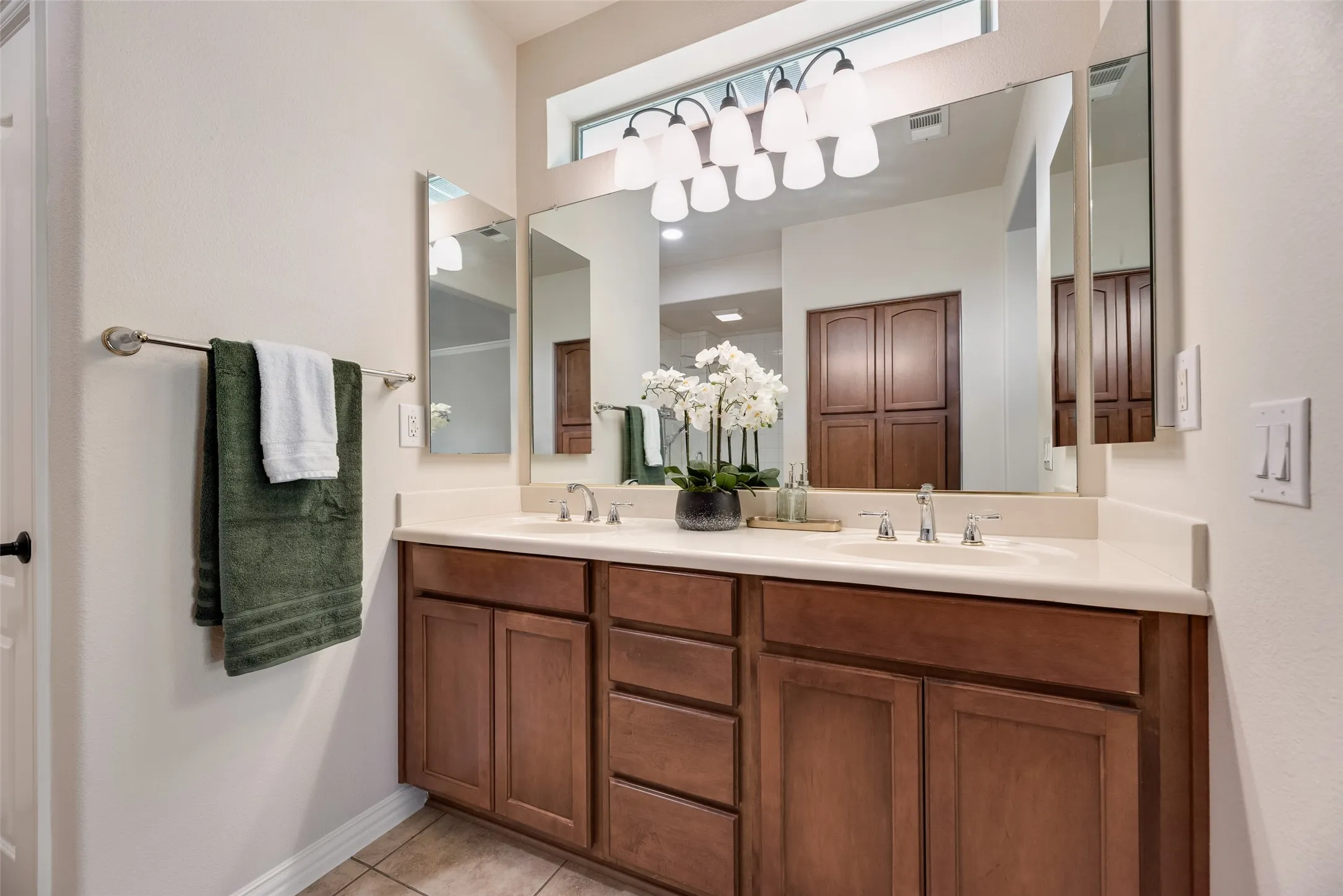 lots of drawers, peek a boo window above, double sinks, medicine cabinet