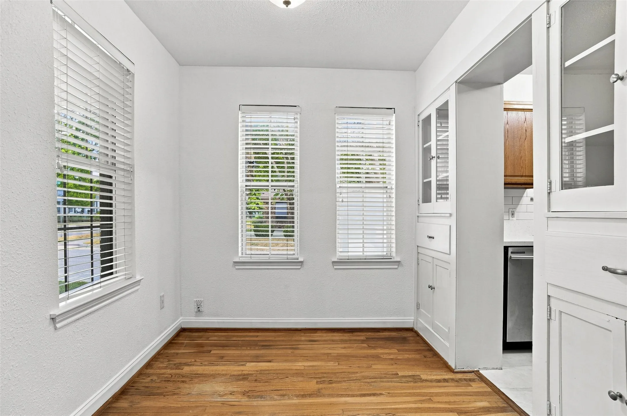 Dining room open to kitchen. Lots of natural light