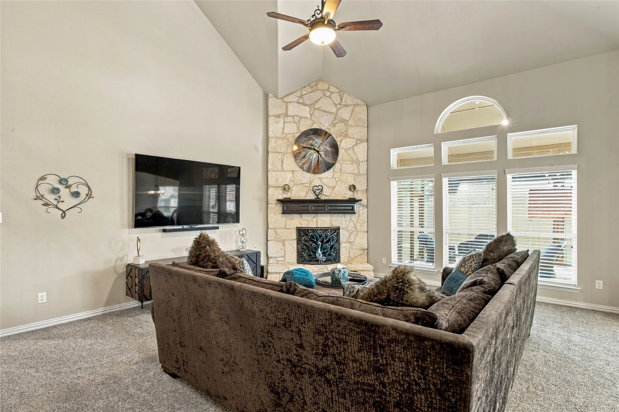 18 ft vaulted ceilings, tons of natural light and stone fireplace