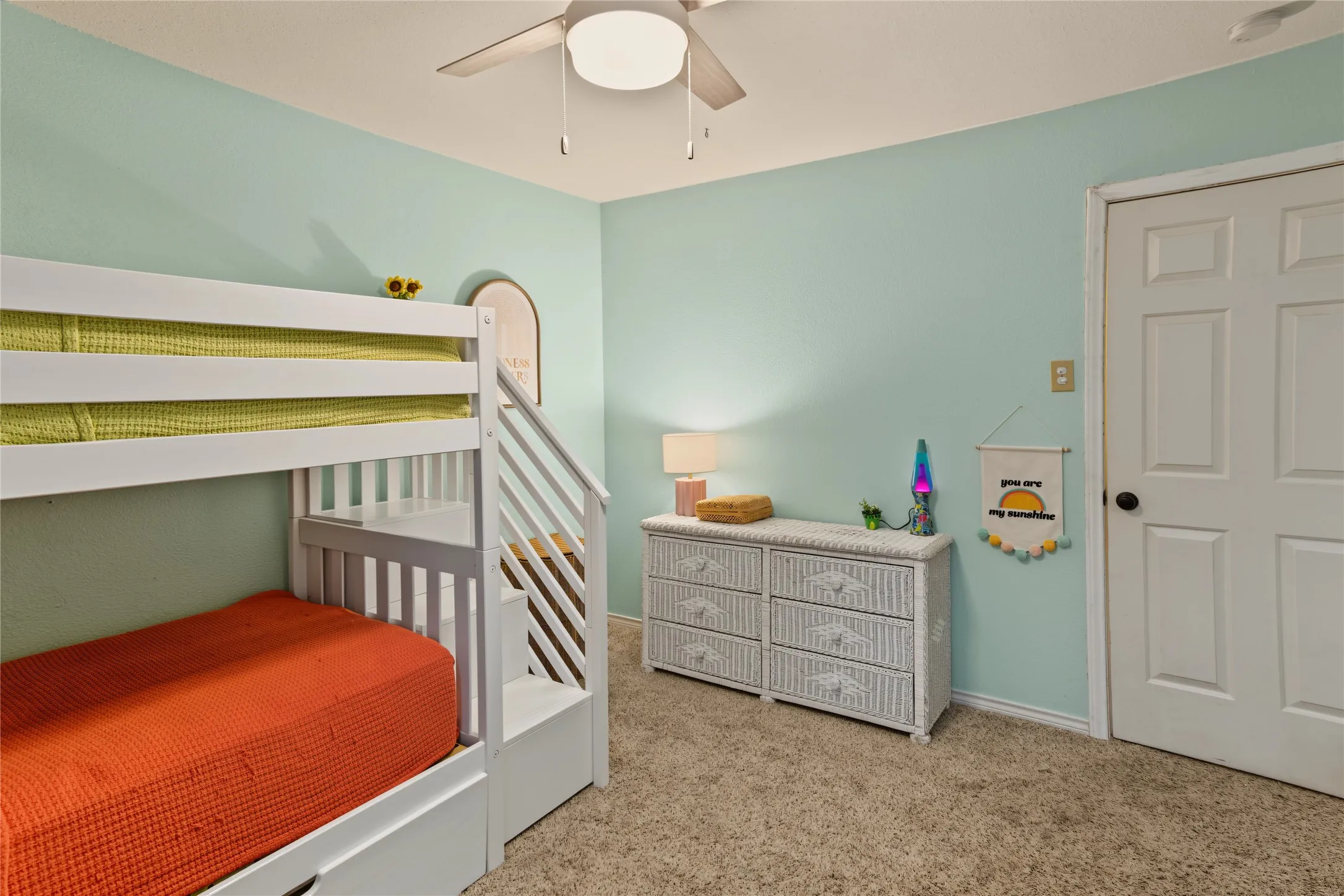 Recessed lighting, ceiling fan, carpeted flooring, and a paneled interior door