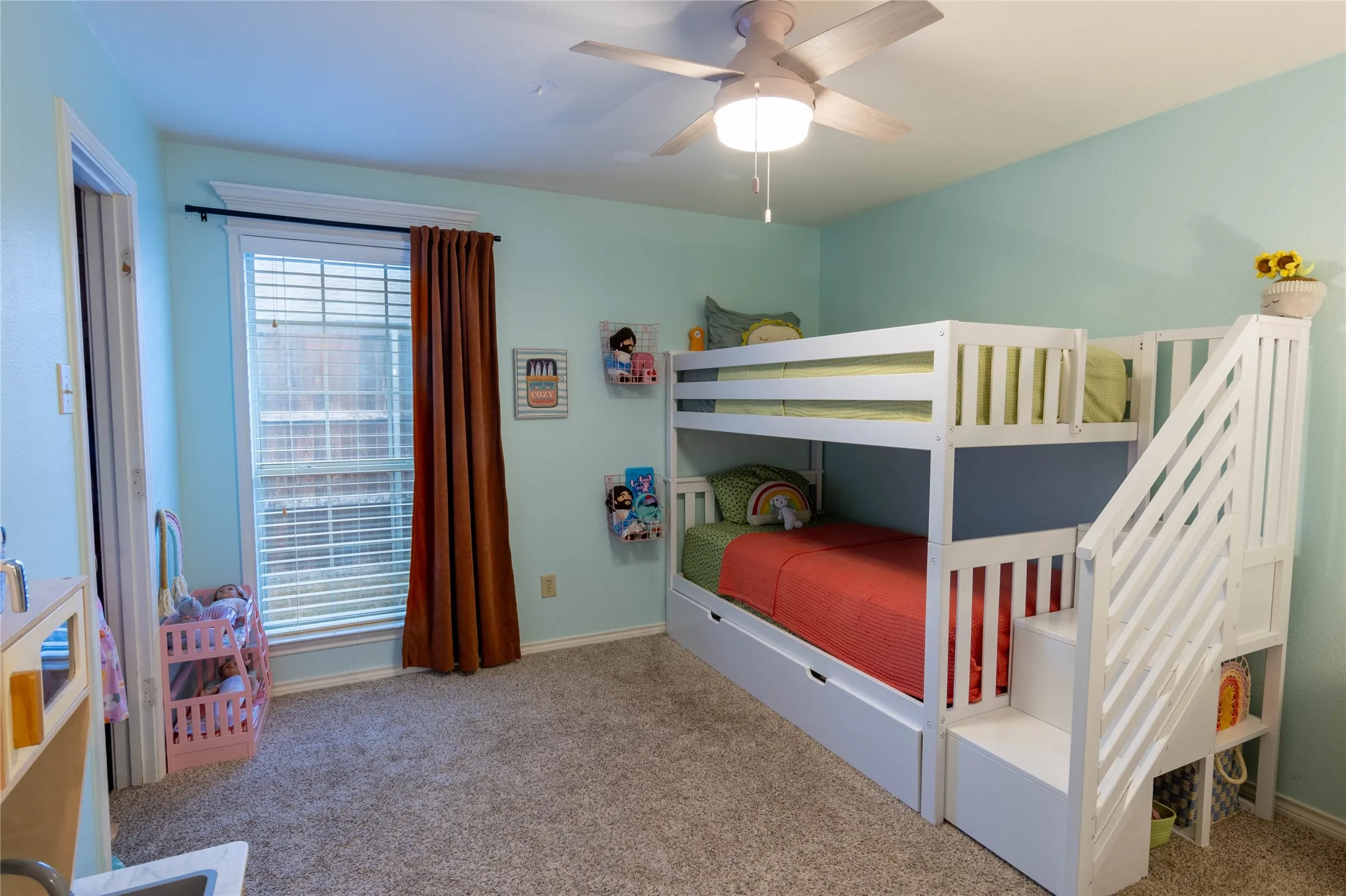 Carpet flooring, ceiling fan with integrated lighting, and a window with blinds