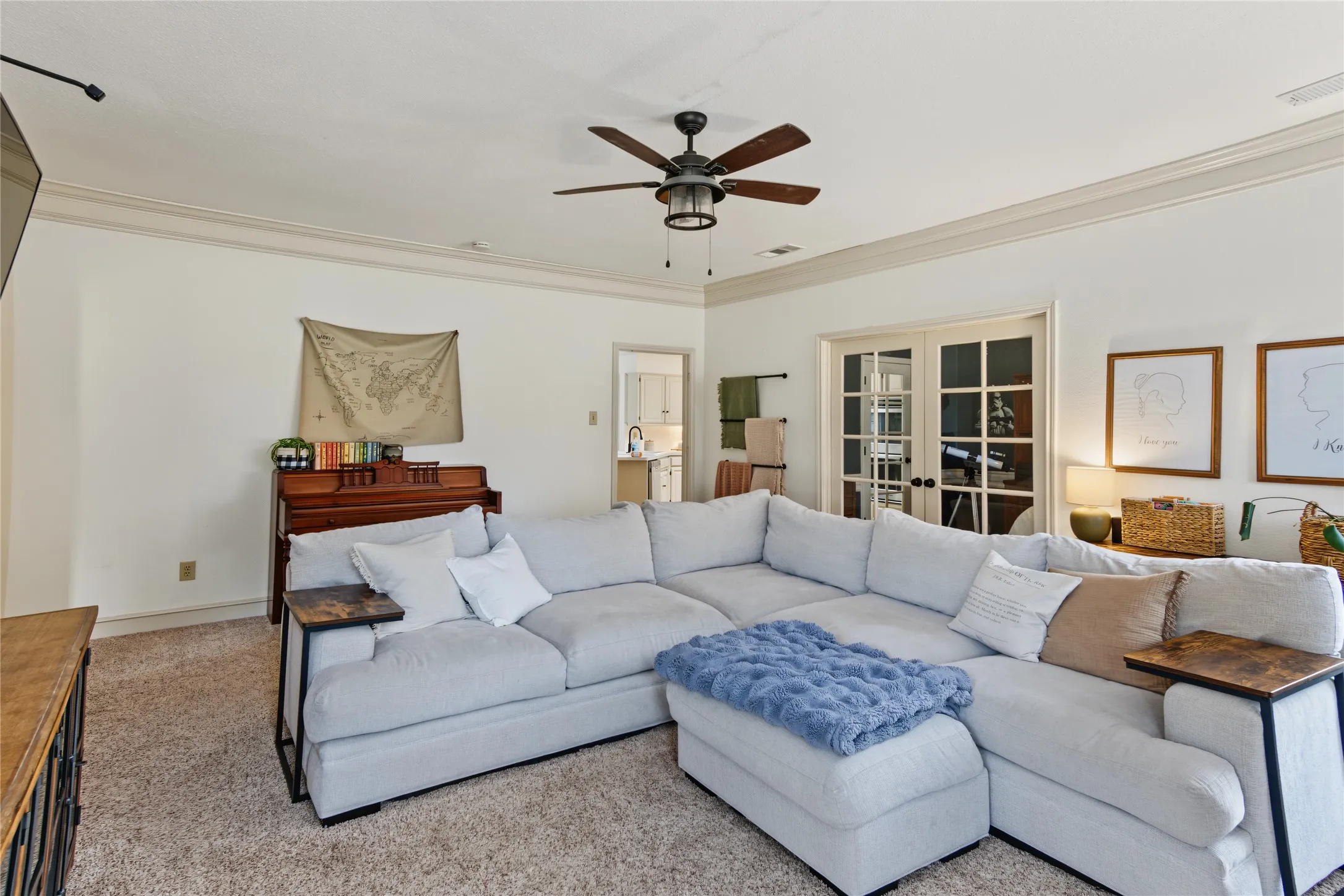 Recessed lighting, crown molding, and a ceiling fan