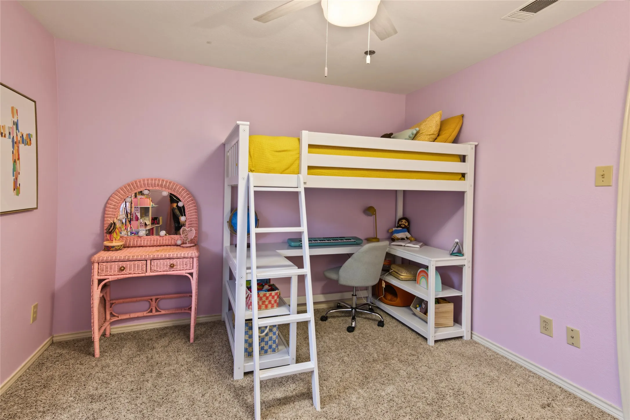 Plush carpet flooring, ceiling fan, and painted walls