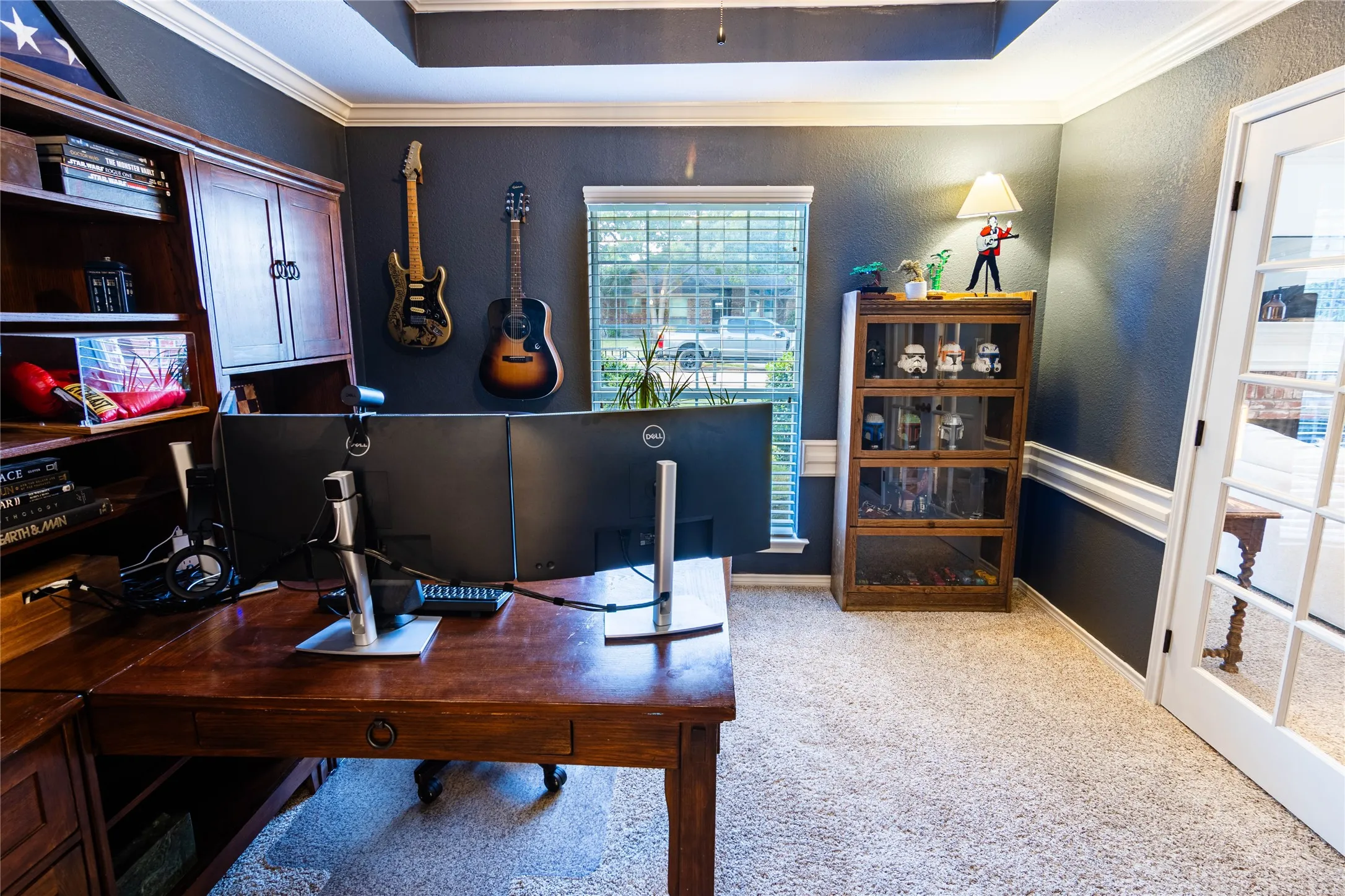 Carpeted flooring, crown molding, chair rail, and French doors with glass panels