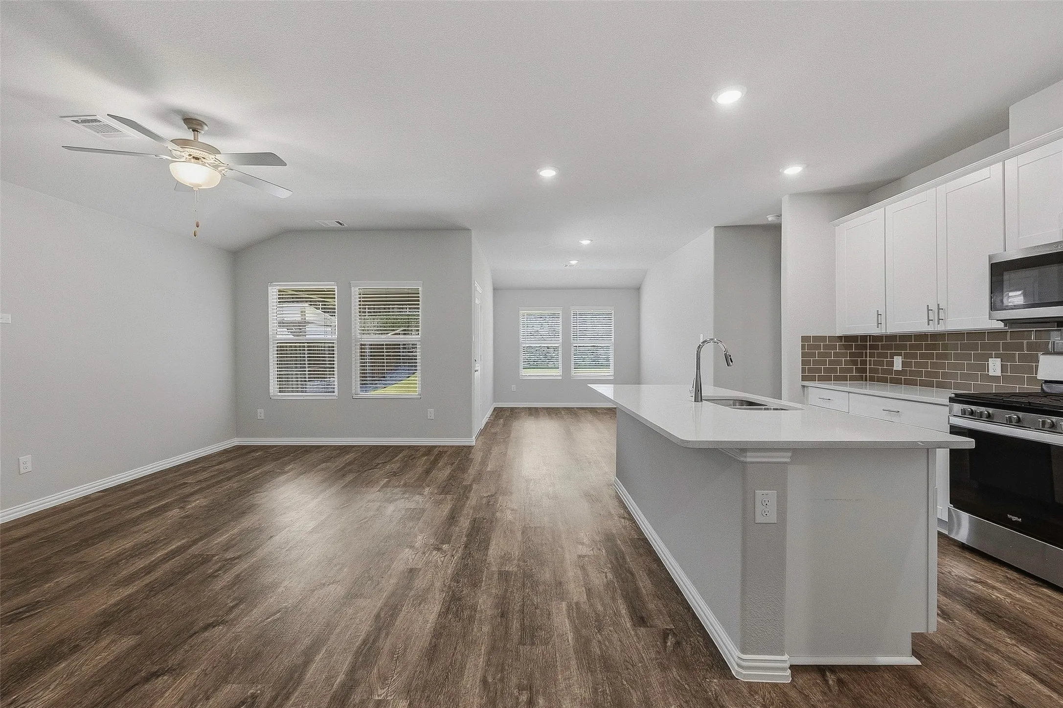 View from foyer of kitchen and living and dining - open concept