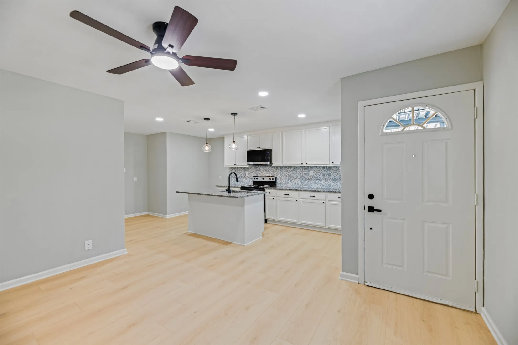 New flooring and ceiling fans throughout