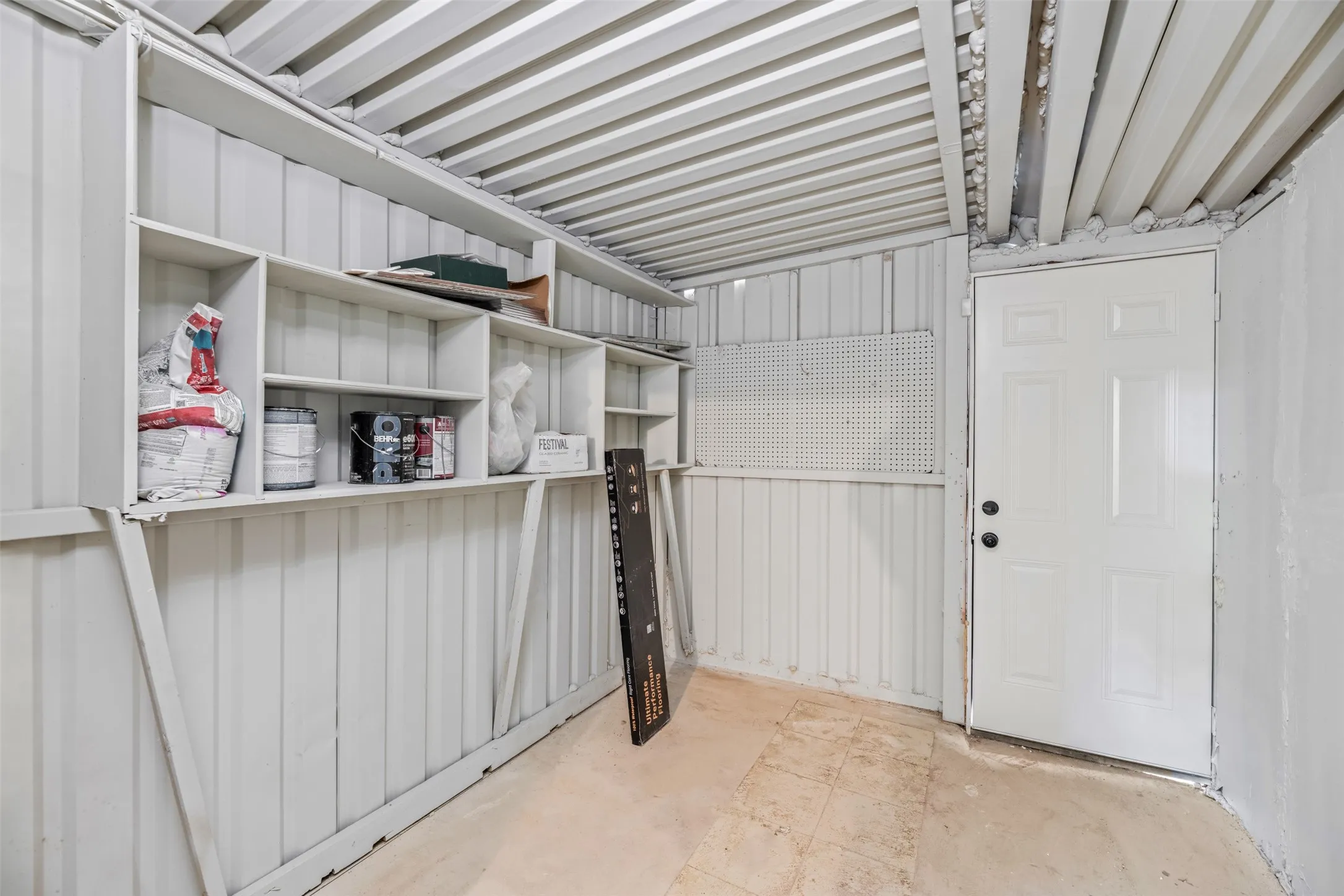 Storage area for lawn equipment