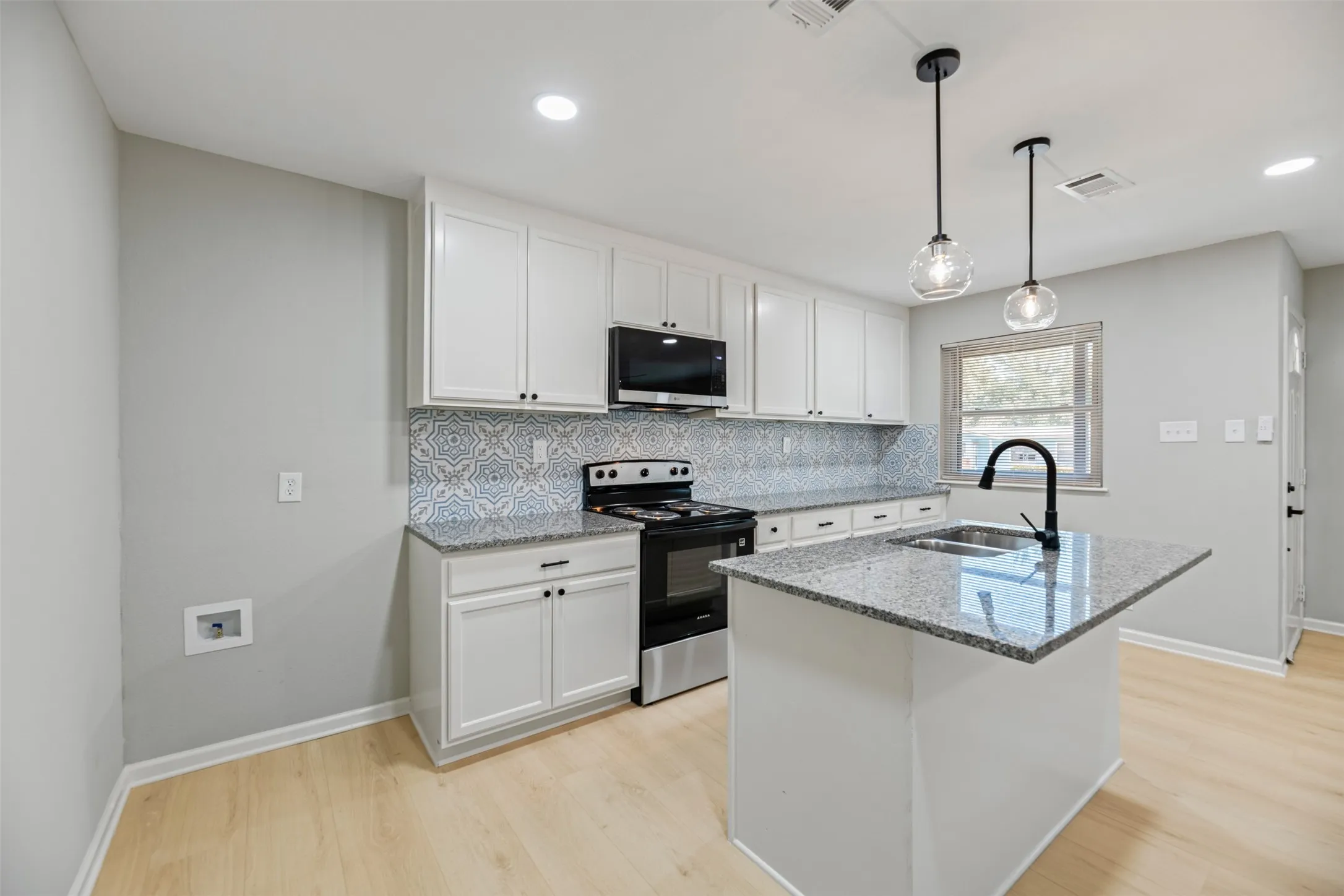 New stainless appliances, sink, faucet and disposal