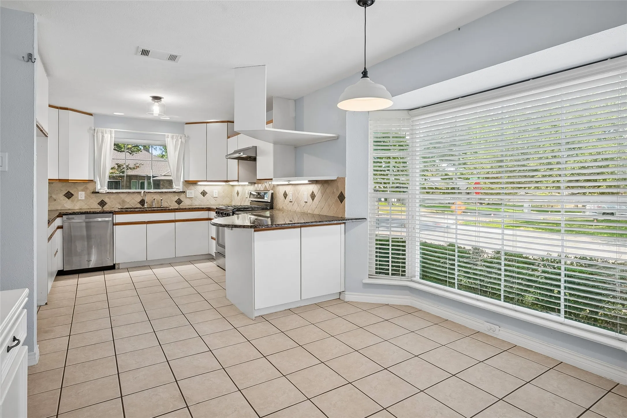 Family and friends can enjoy a spacious, relaxed setting.  Stainless appliances include a gas range with overhead vent.