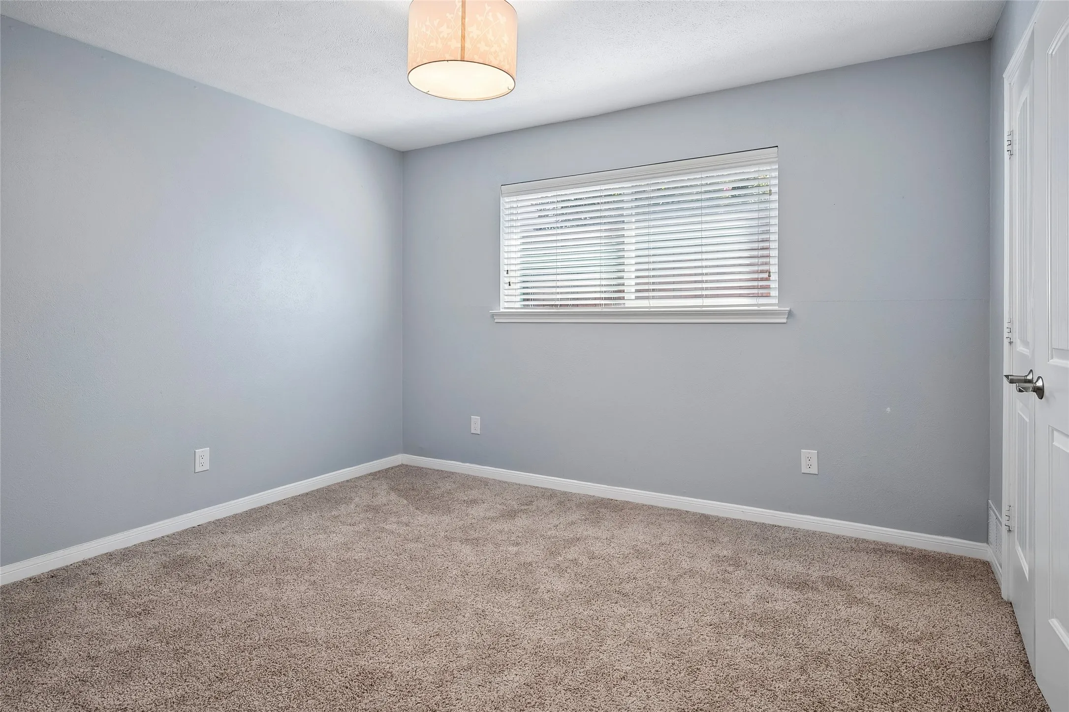 Soft neutral paint with white woodwork flow through the home.
