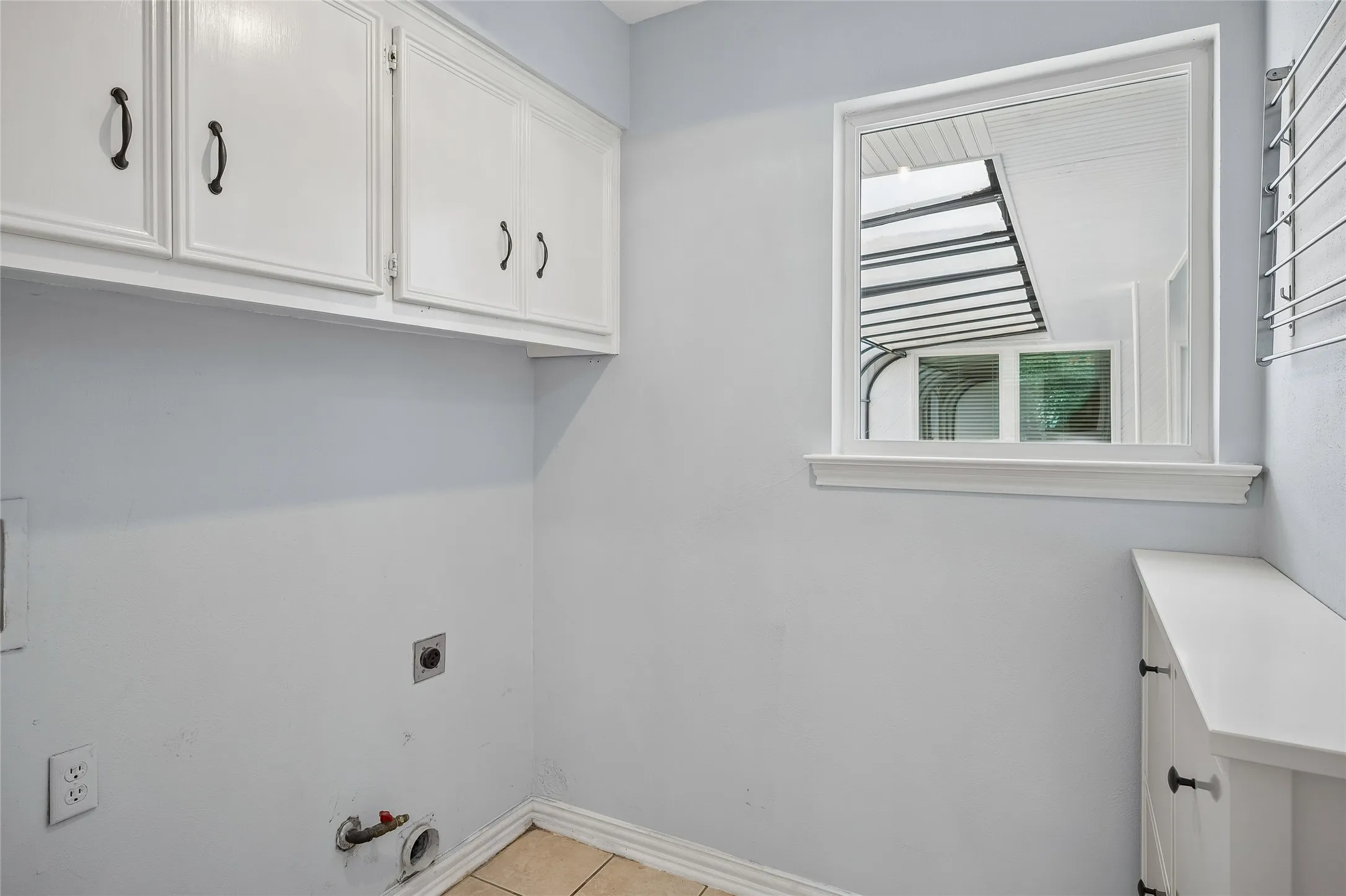 A barn door opens from the family room to the laundry room.
