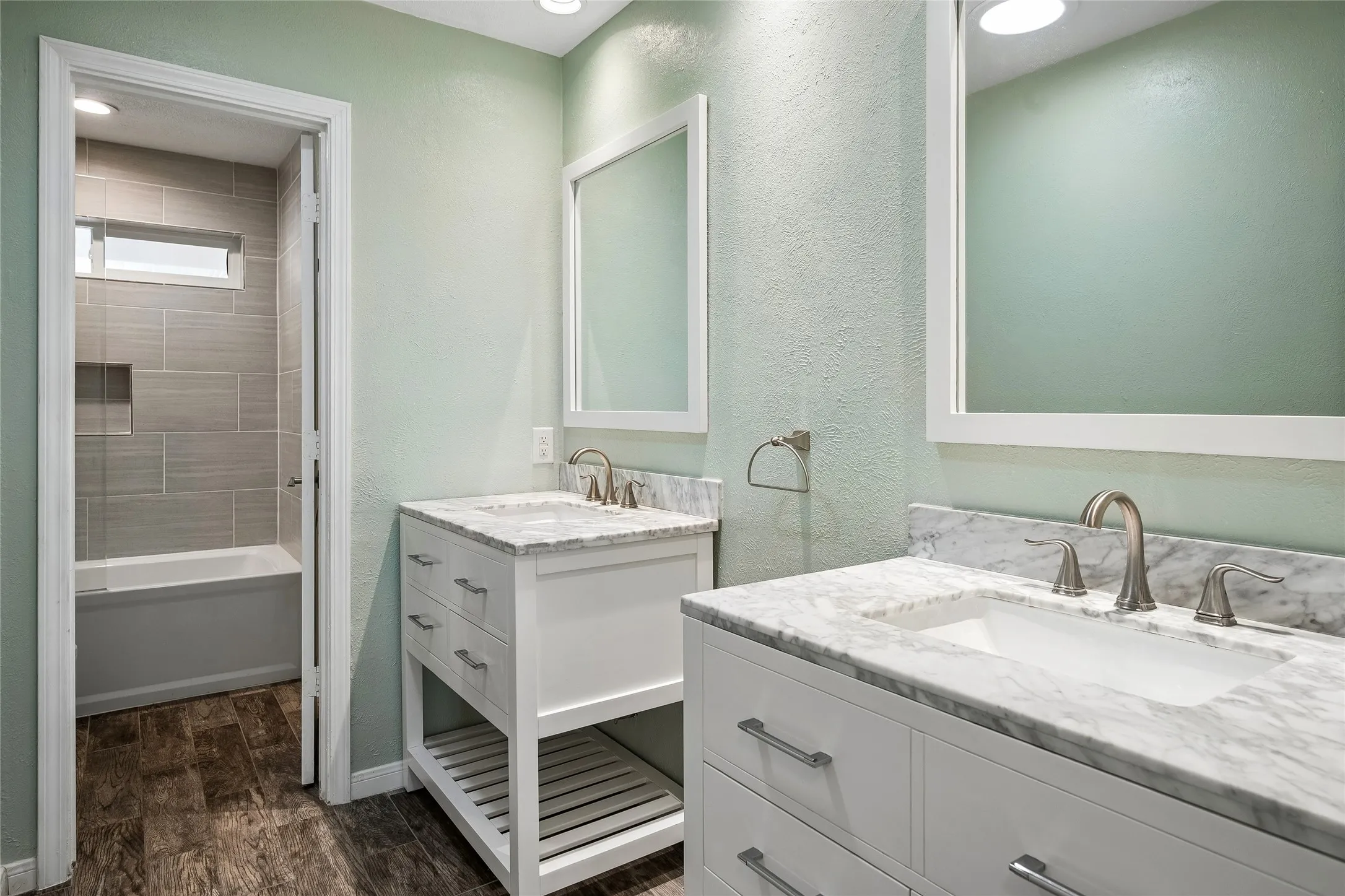 Charming full secondary bath with separate vanities