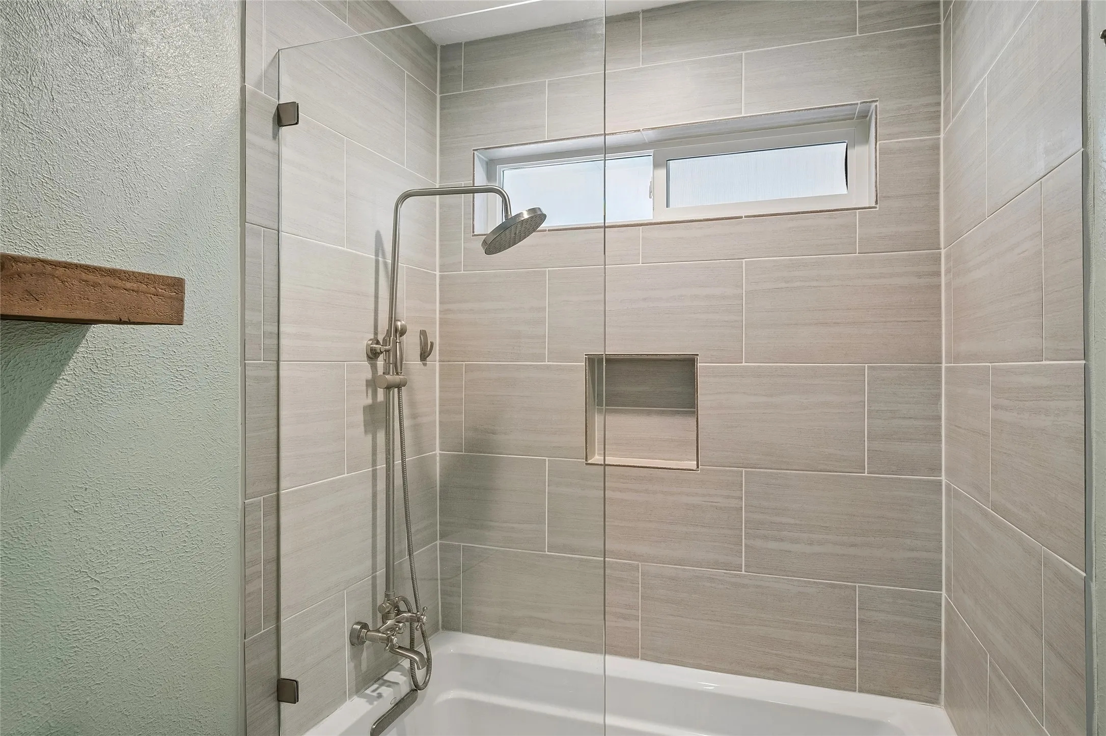 This custom shower serves the secondary bedrooms.
