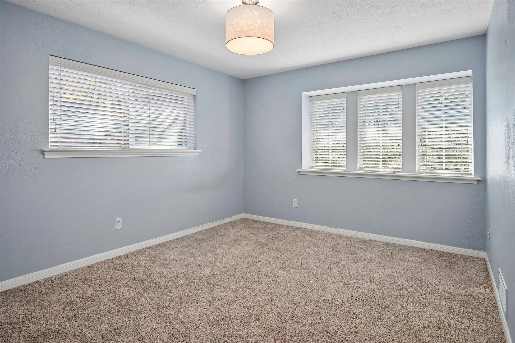 This bedroom offers a walk-in closet.