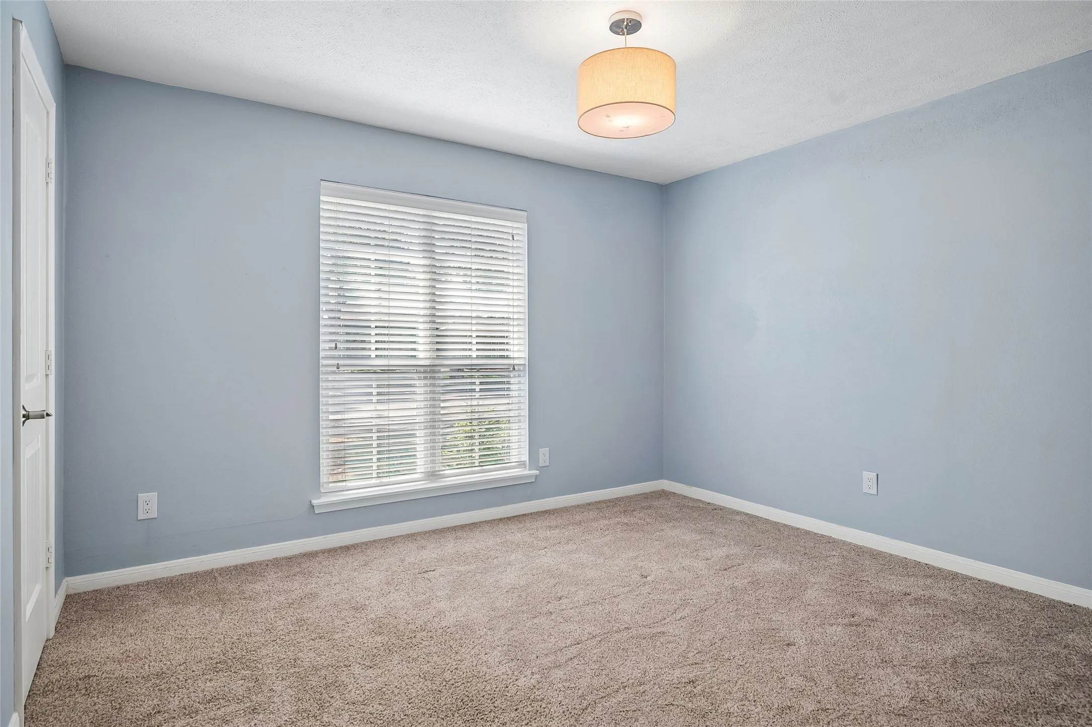 This secondary bedroom faces the  front yard.