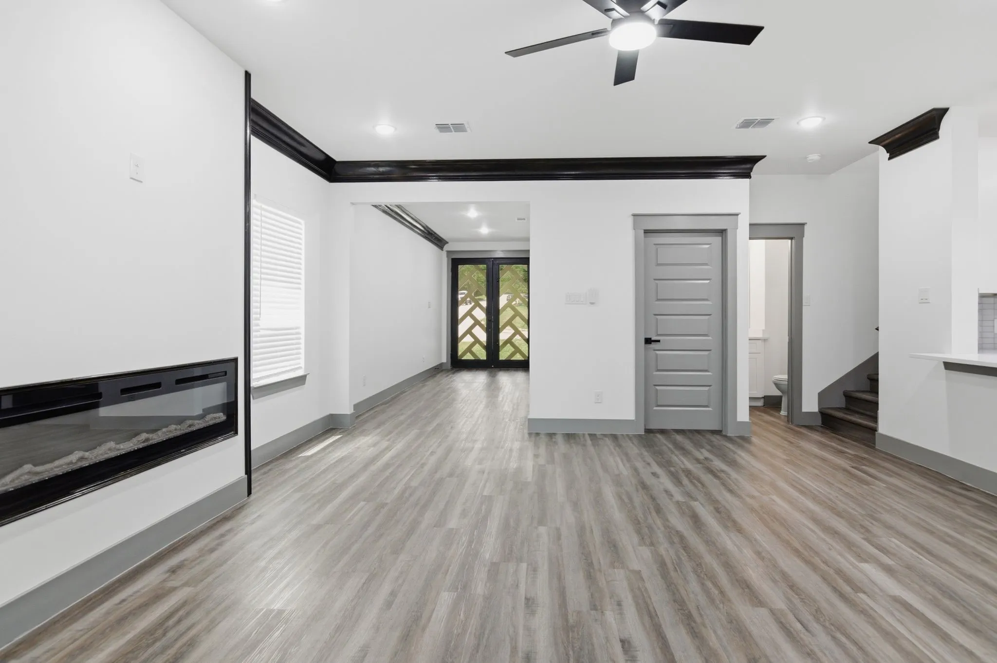 Wood-finish flooring, recessed lighting, and a modern ceiling fan