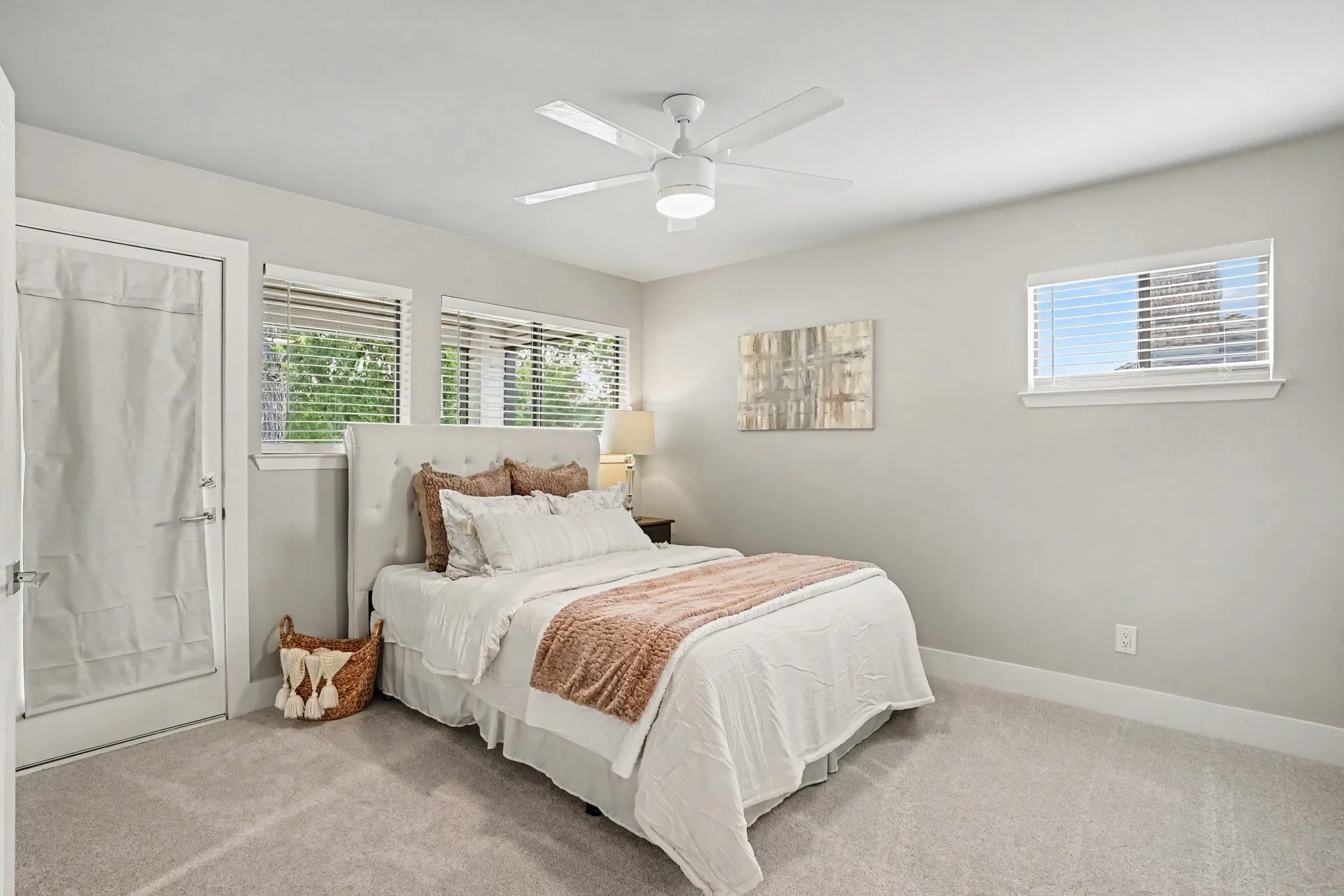 Guest bedroom with balcony looking onto golf course and walk-in closet