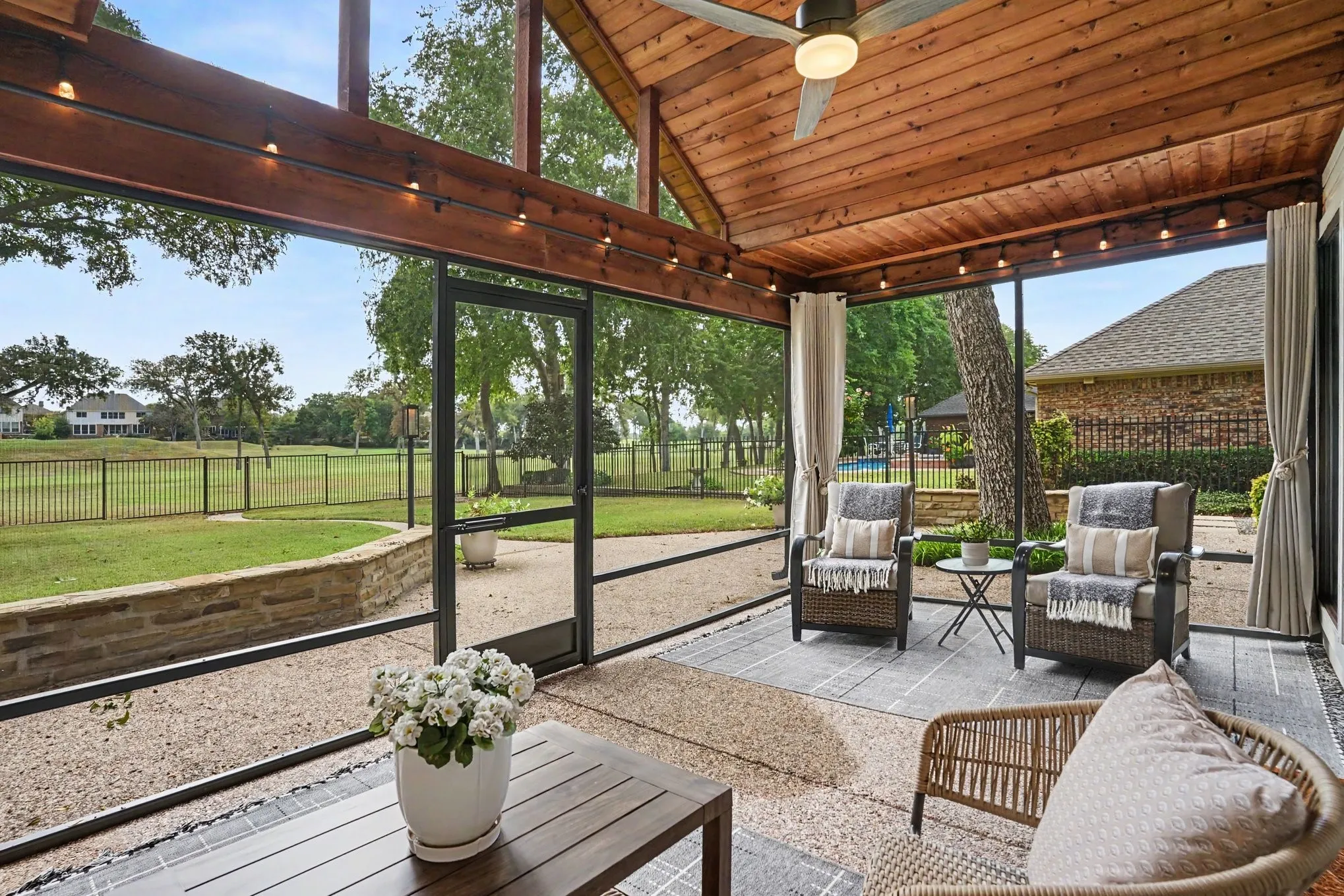 Enclosed patio looks out onto golf course