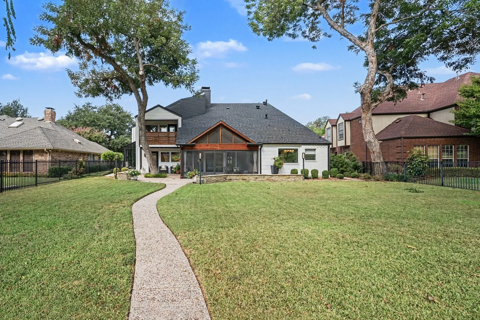 Back of house and yard from golf coursse