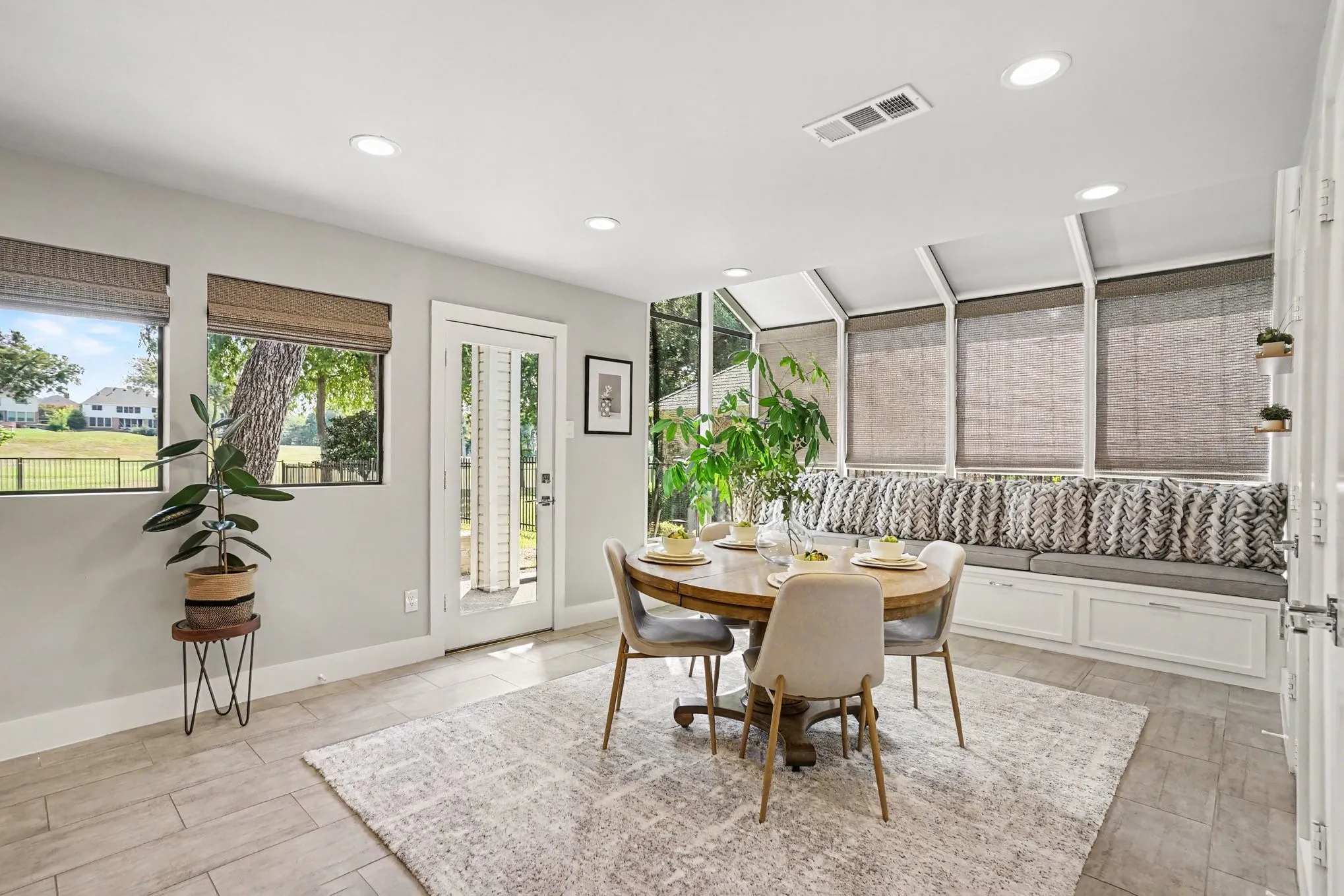 Breakfast room with storage bench and door to backyard