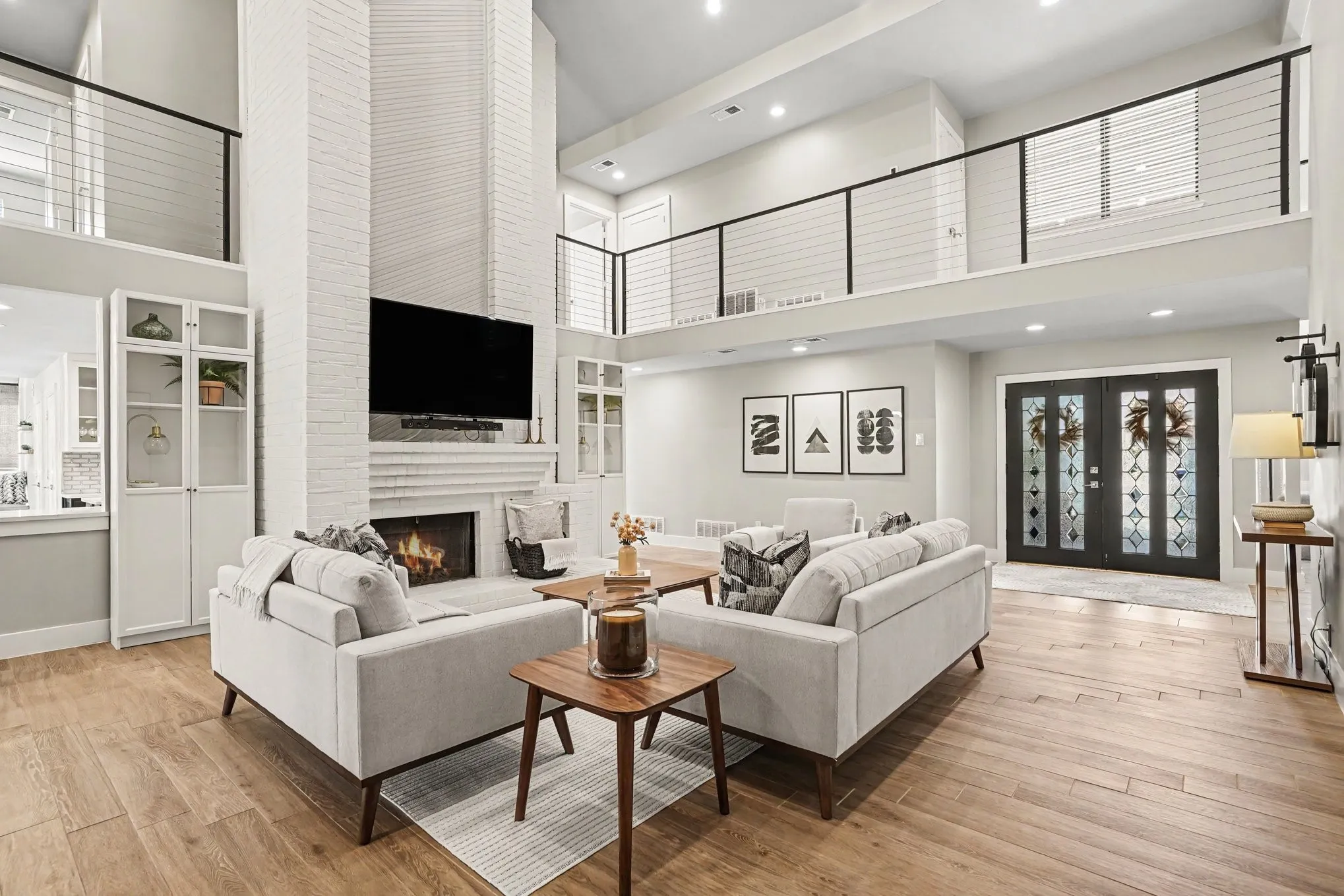 Spacious living room with gas fireplace and vaulted ceiling
