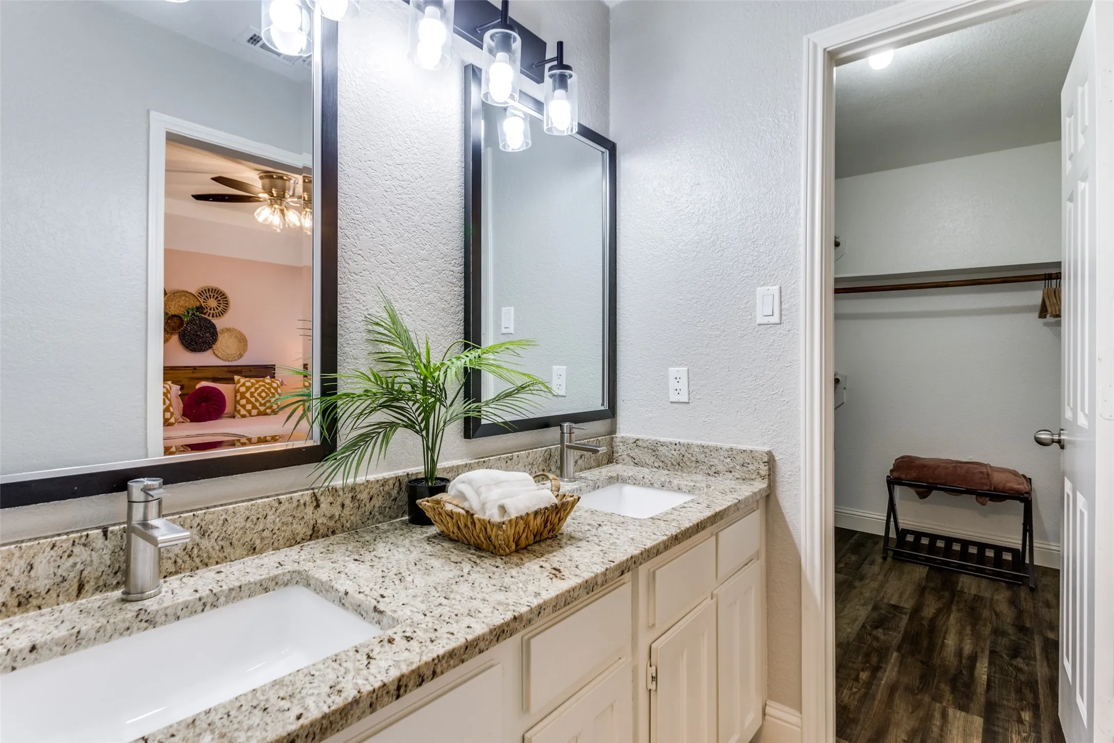 Dual vanity with granite-style countertops and undermount sinks