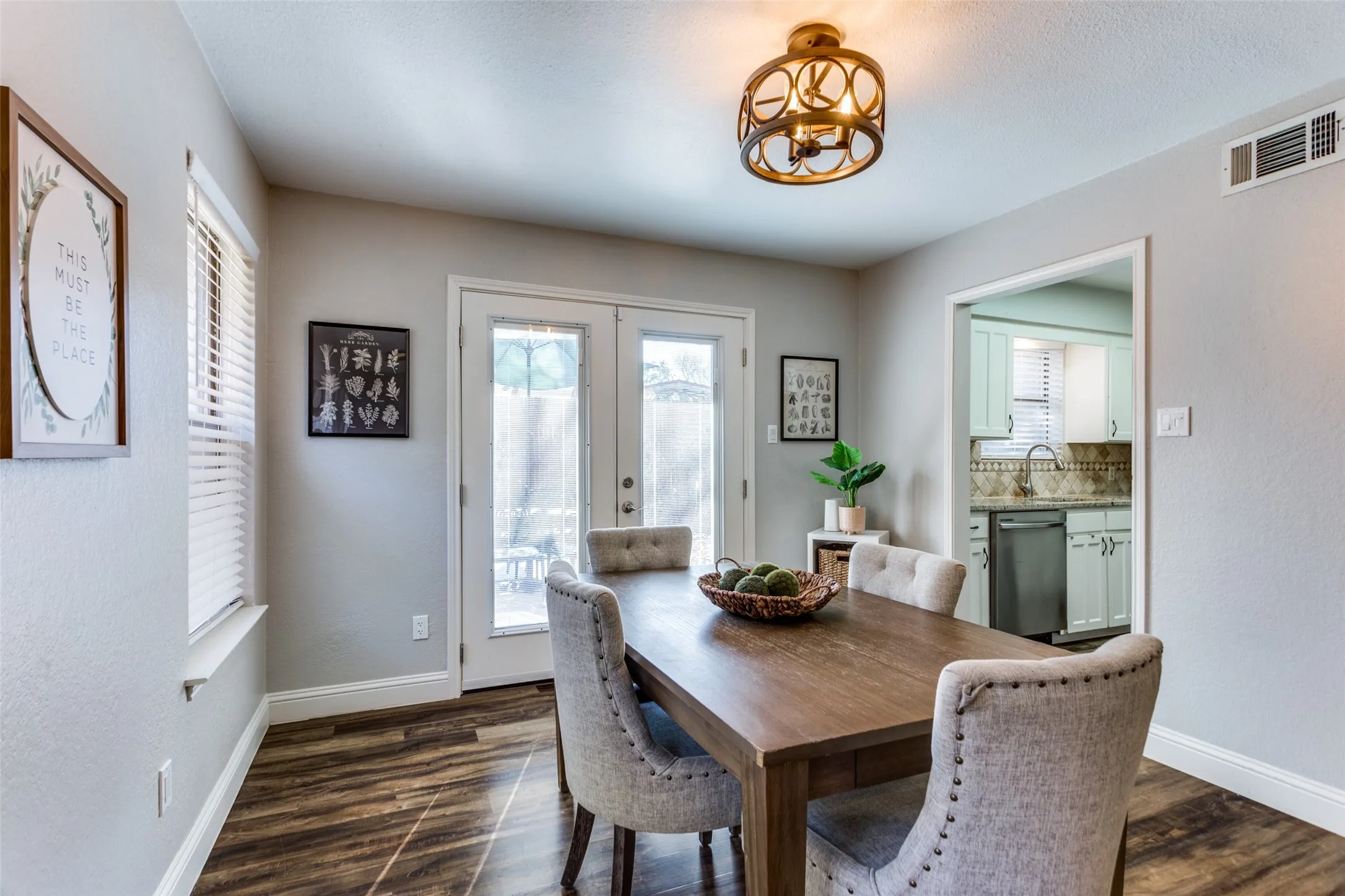 Wood-finish flooring, French doors, and recessed lighting