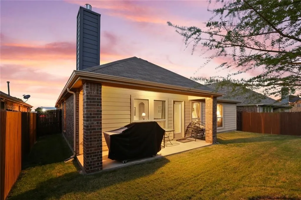Covered patio with brick columns, siding exterior, and shingle roofing