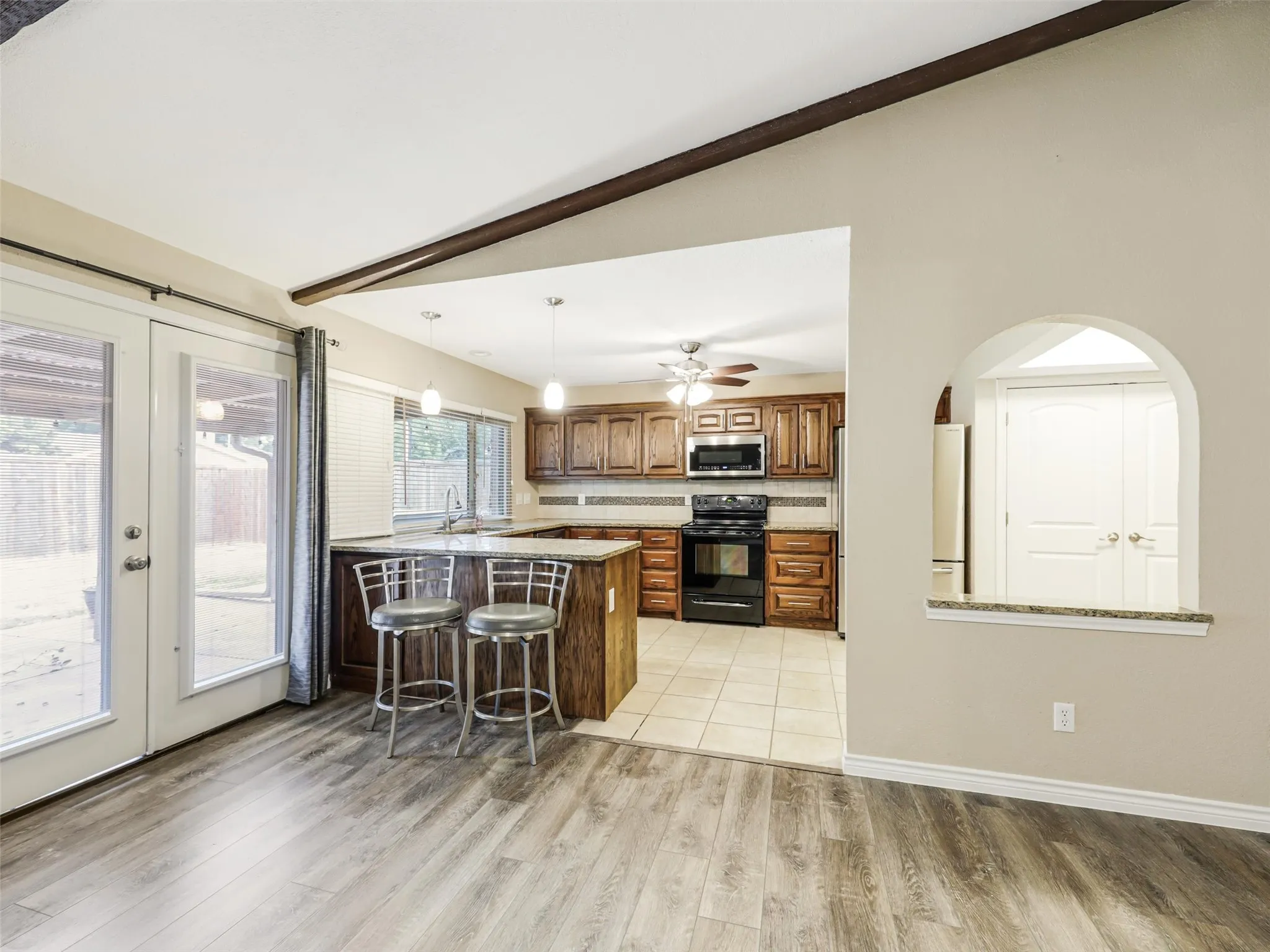 Wood-finish flooring extending into the living area