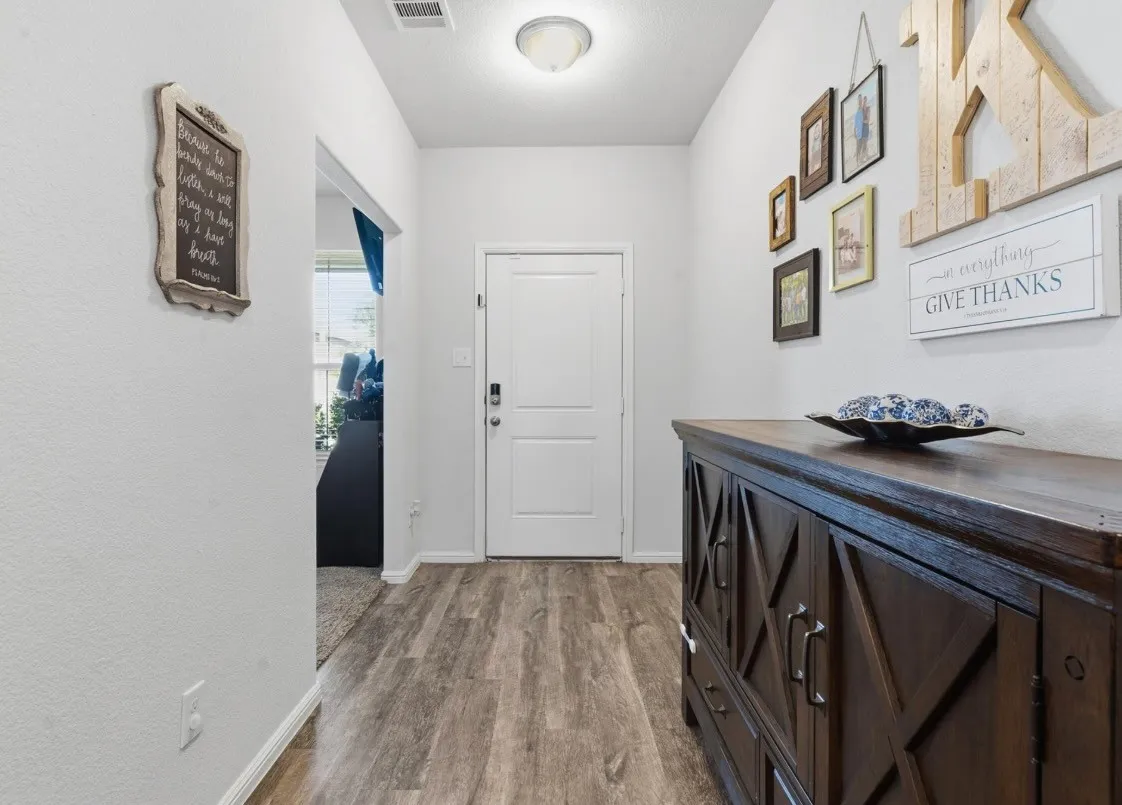 Wood-finish flooring throughout the space