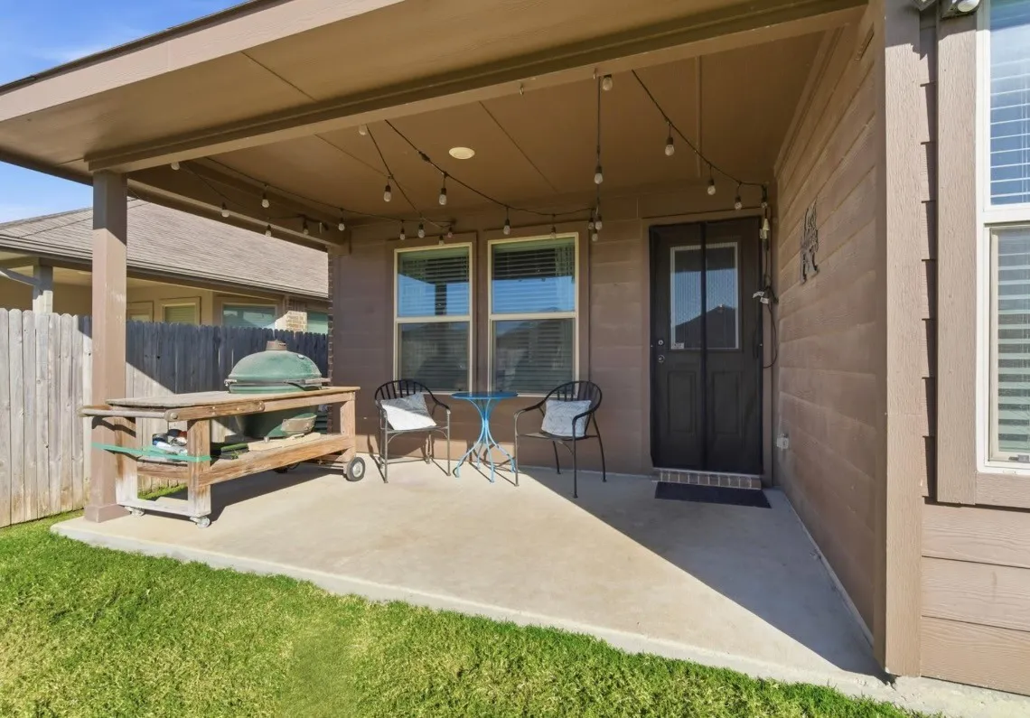 Covered patio with concrete flooring, recessed lighting, and string lights