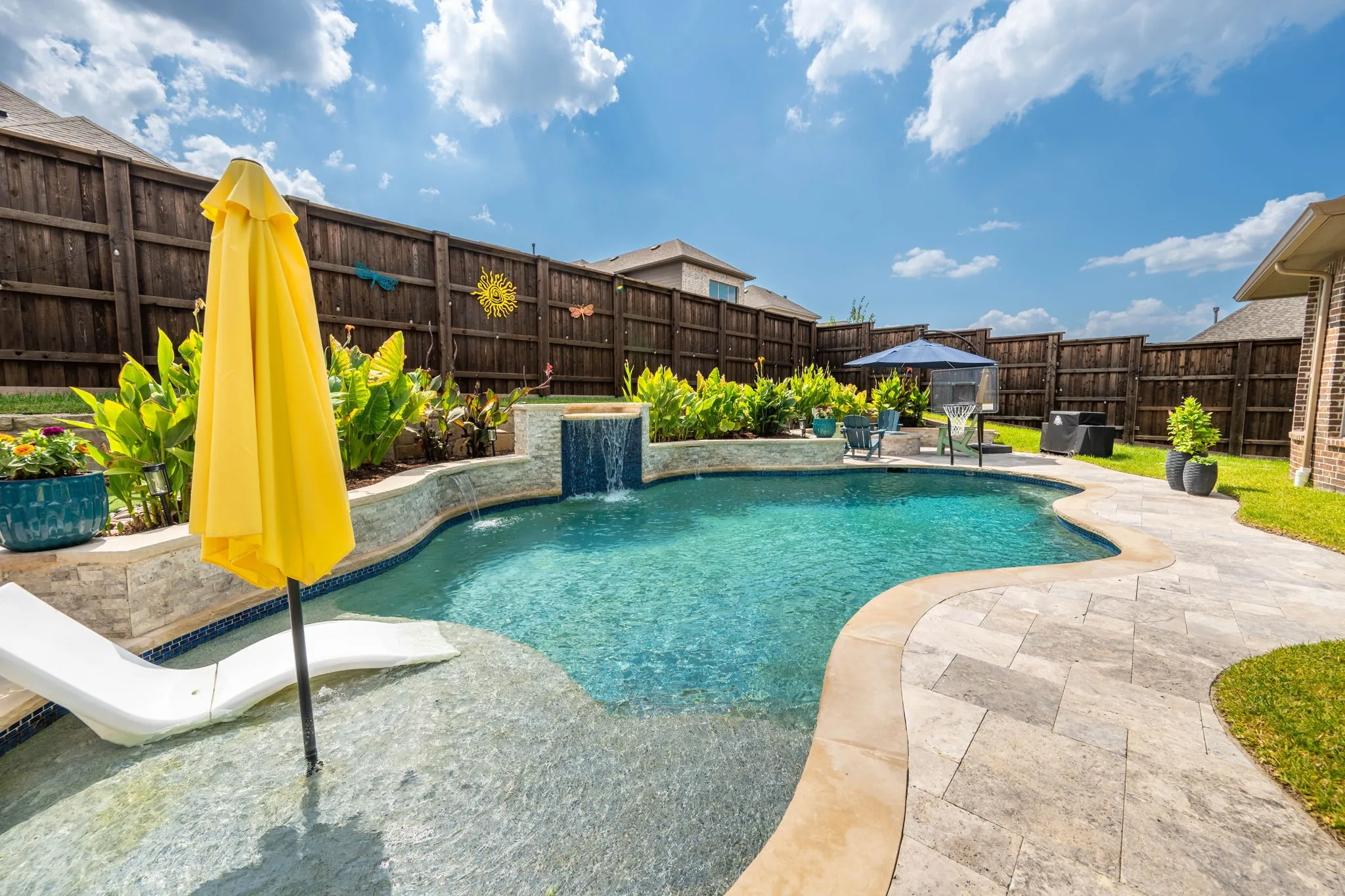 Heated pool with water fall