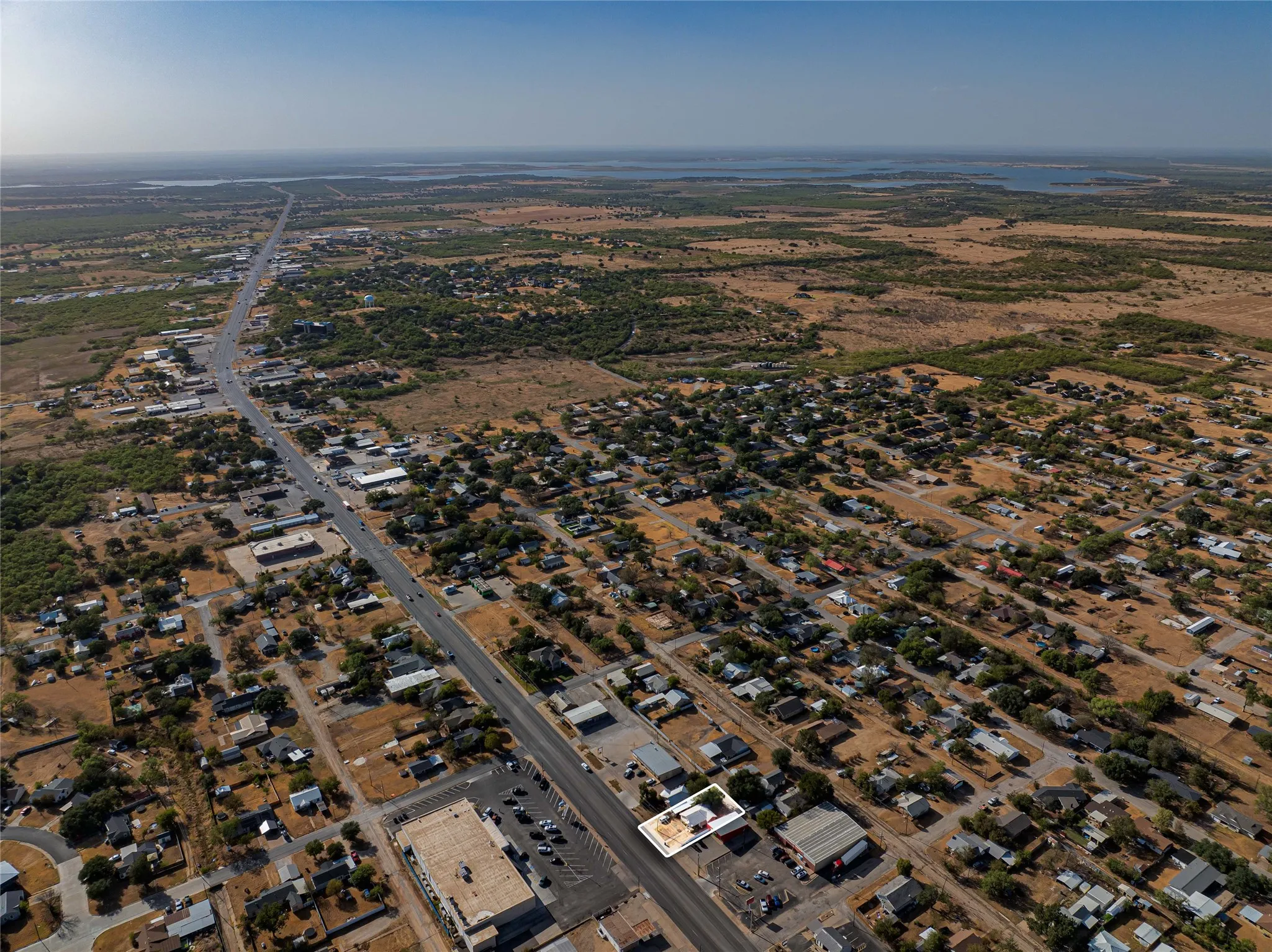Aerial overview showcasing a developed area with extensive surrounding natural landscape