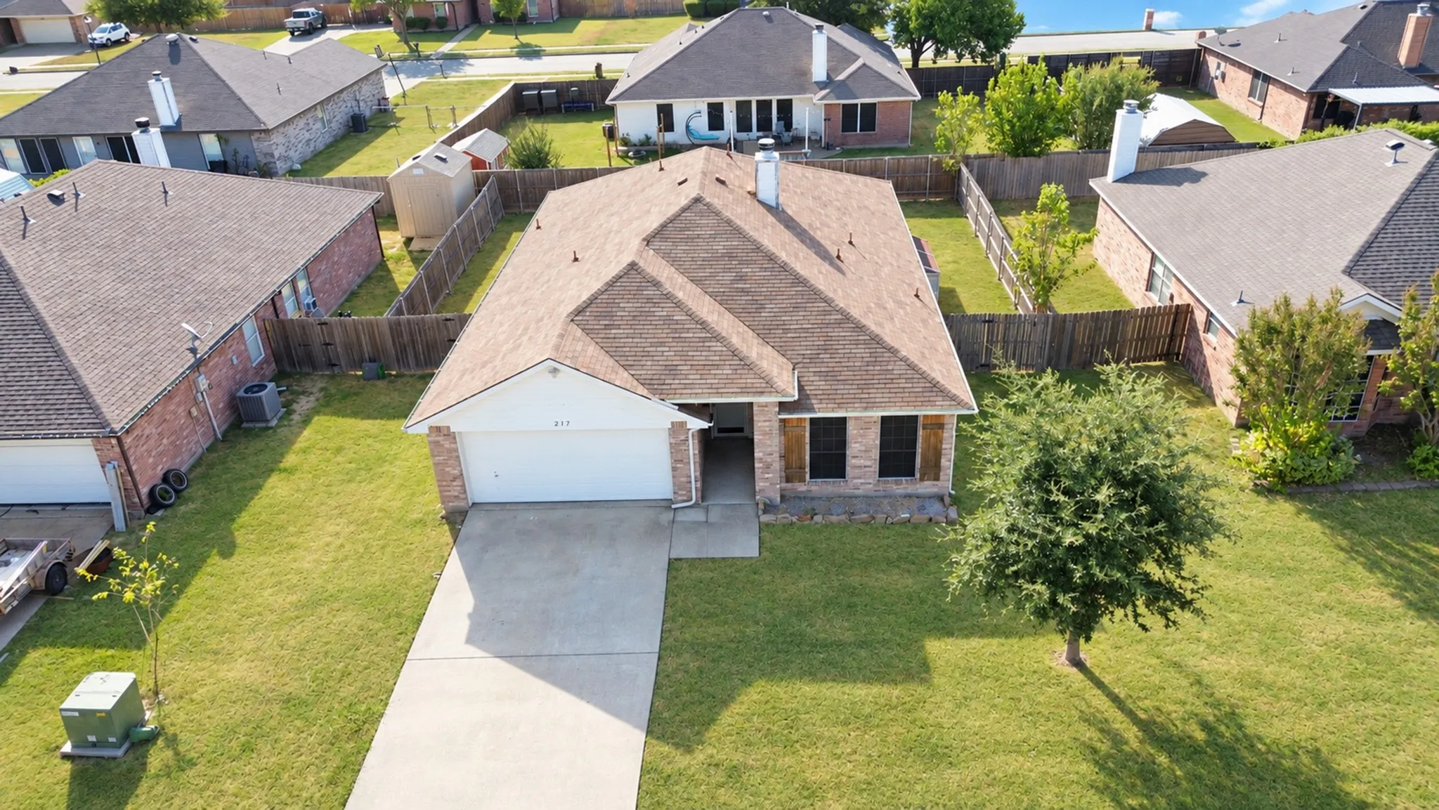 Front-facing garage with concrete driveway