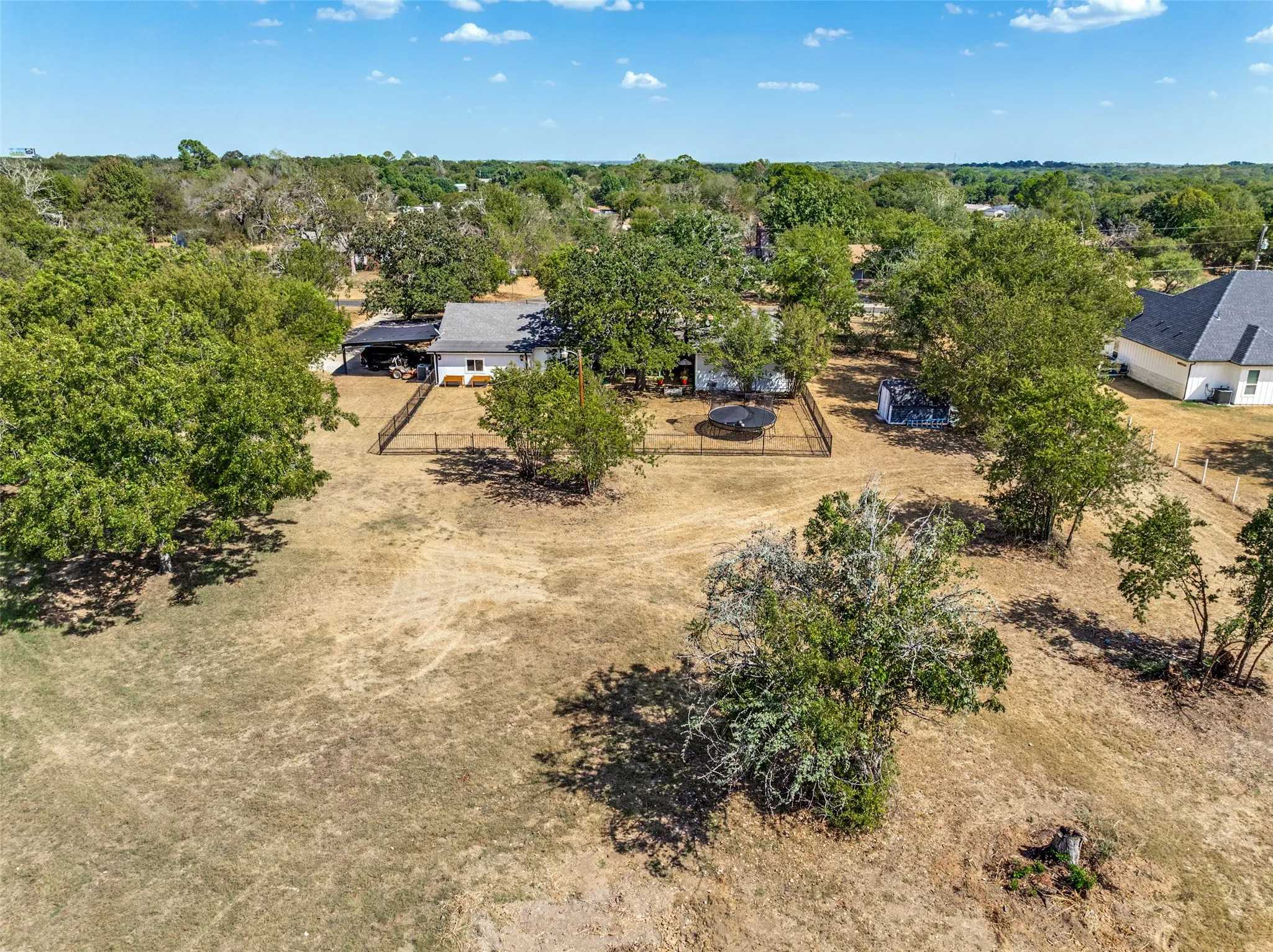 Spacious lot with a single-story residence and detached carport