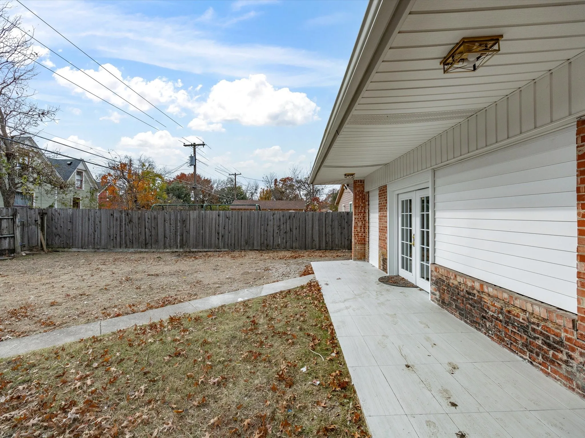 Expansive backyard with a wooden fence