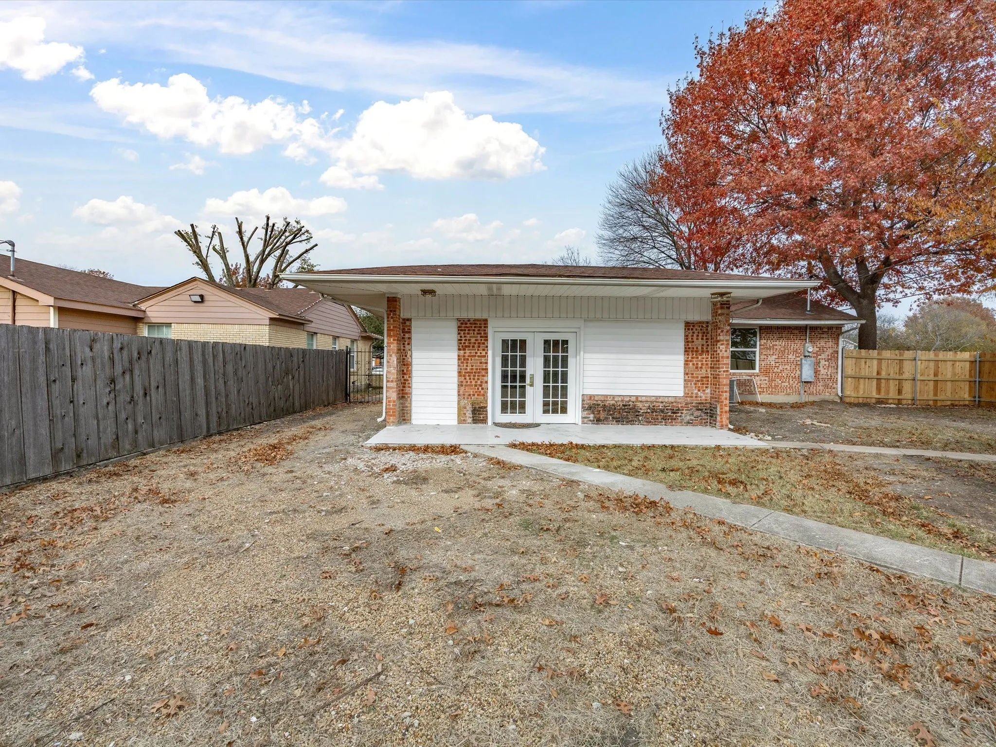 Brick and siding exterior with a covered porch