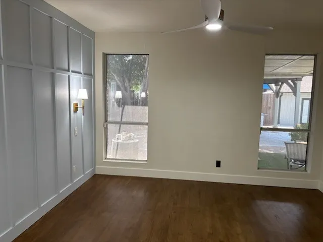 Large primary bedroom downstairs with views of the outside