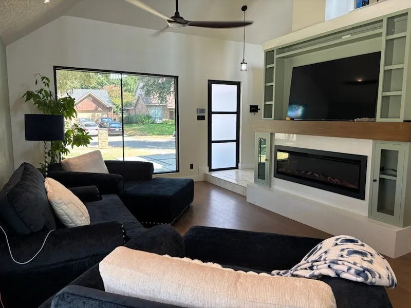Vaulted ceiling with a ceiling fan, with lovely views through the expansive rectangular windows