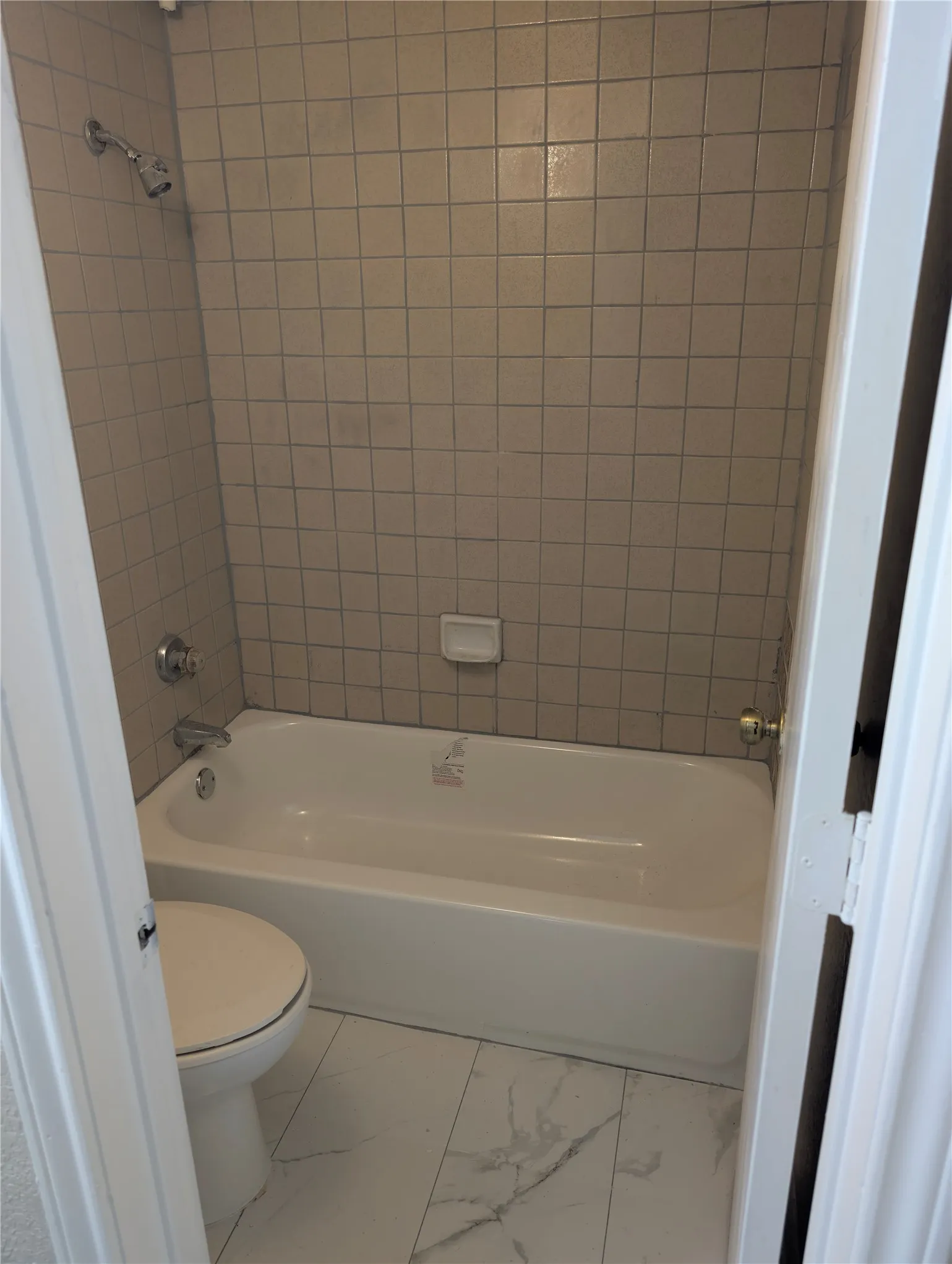 White tile flooring with grey veining