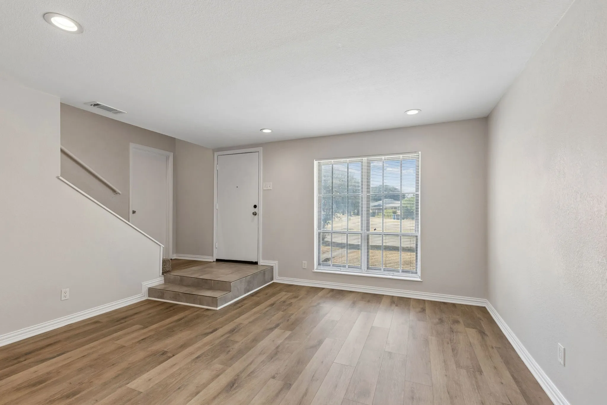 Primary bedroom is through the door on the left