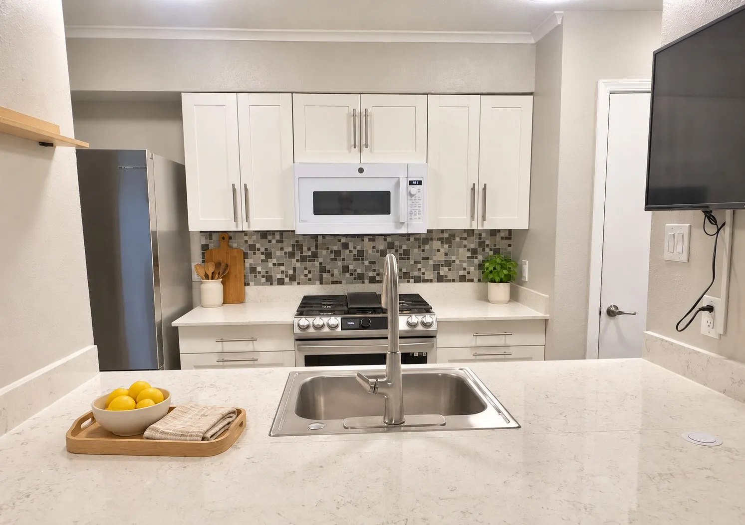 Kitchen featuring stainless gas range with grill
