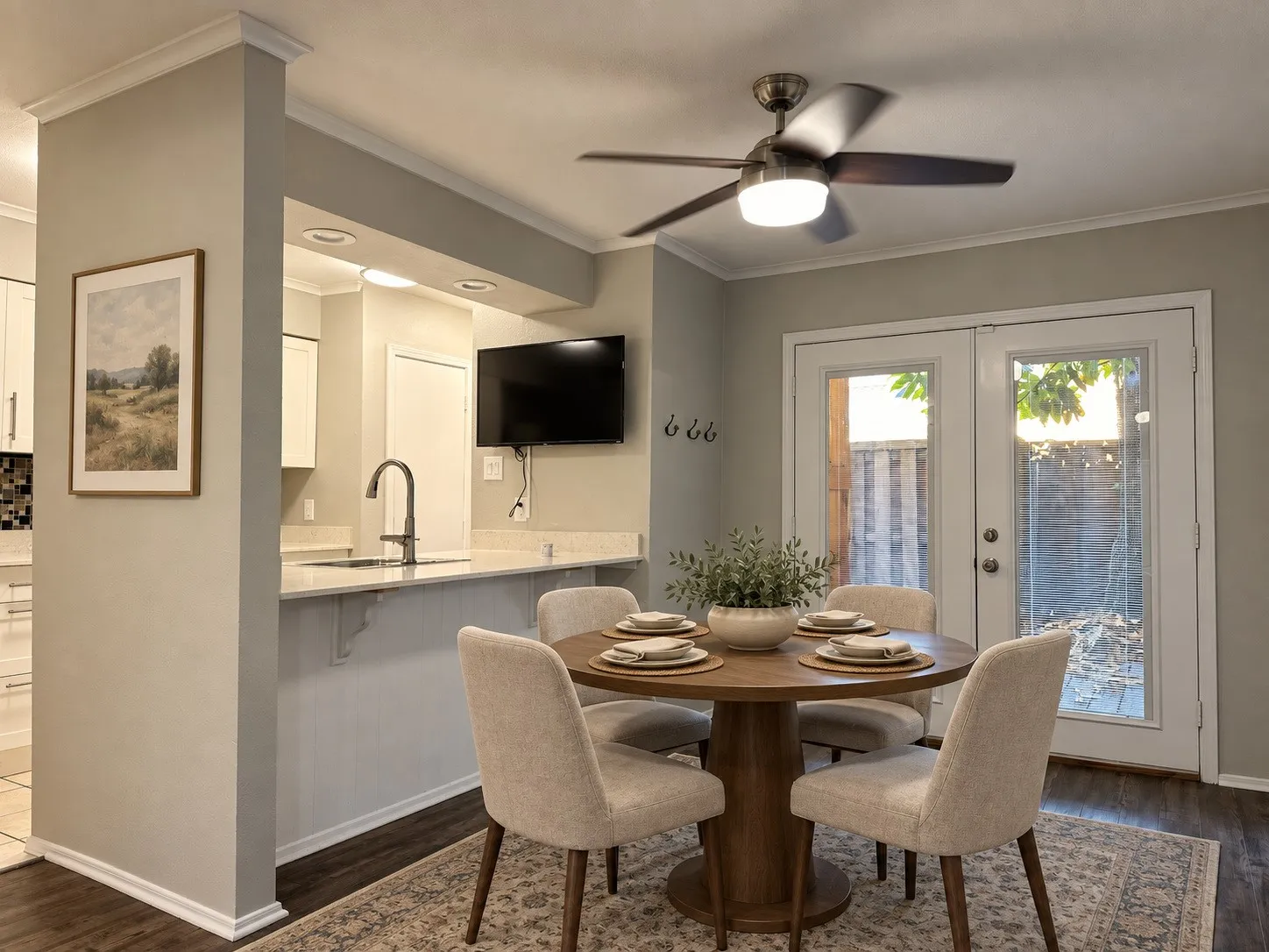 Kitchen pass-through with quartz-finish countertop and contemporary faucet