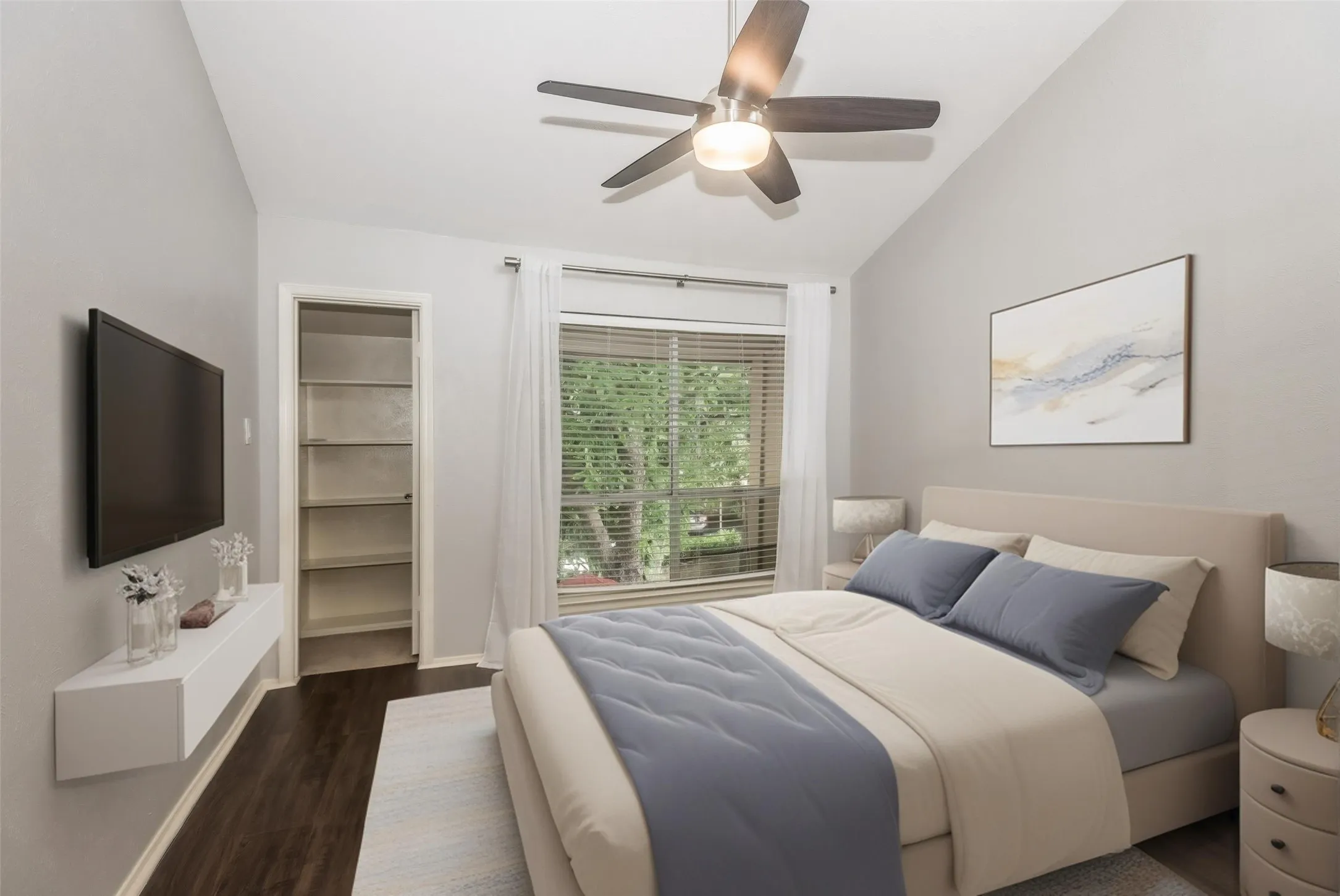 3rd Bedroom - Vaulted ceiling, wood-finish flooring, ceiling fan with integrated lighting, window with blinds and sheer drapes, built-in shelving