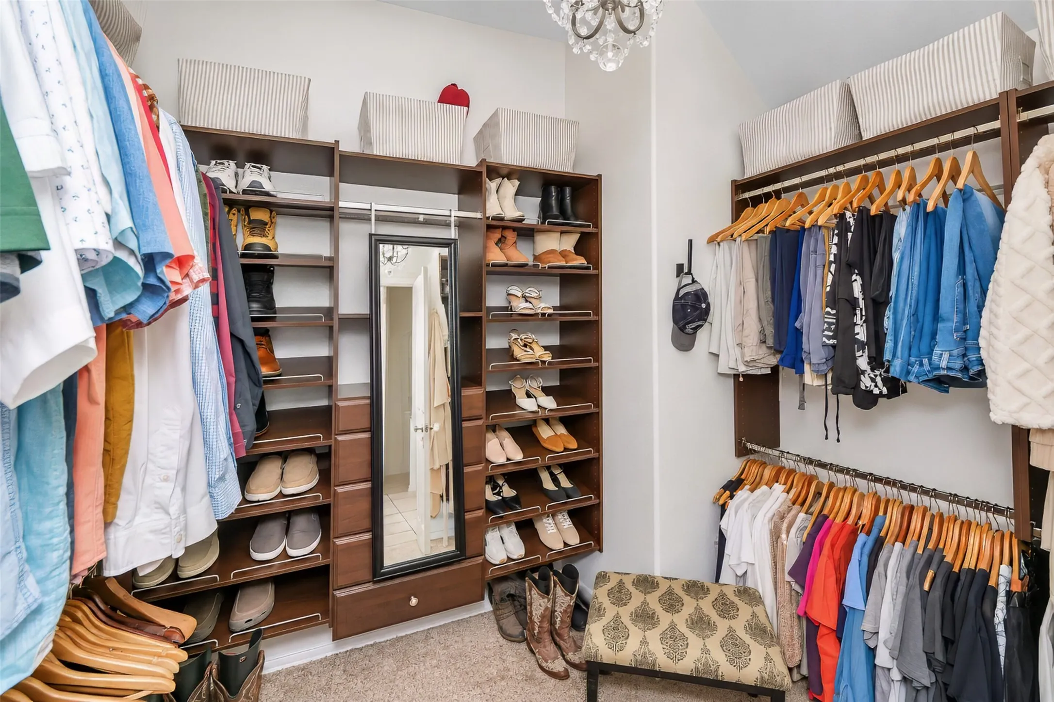 Primary custom closet with drawers and shoe racks